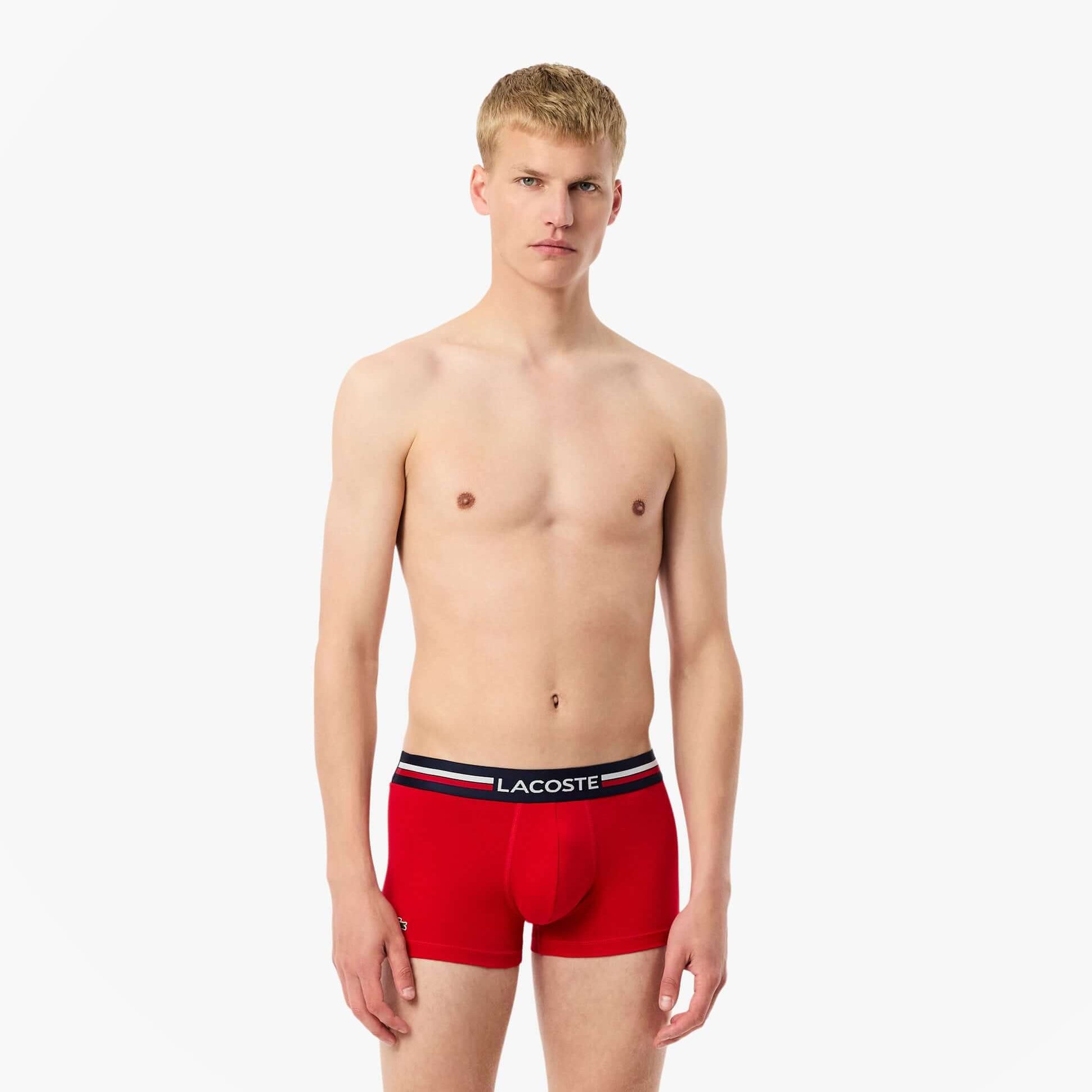 Lacoste 3 Pack Trunks Mens Trunks Navy Blue/Silver Chine/Red front view model wearing red trunks.