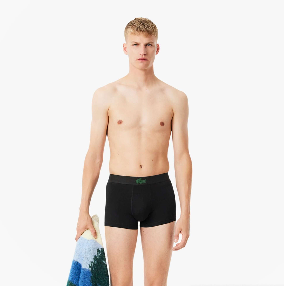 Lacoste 3 Pack Trunks Mens Trunks Black front view model wearing black trunks with towel