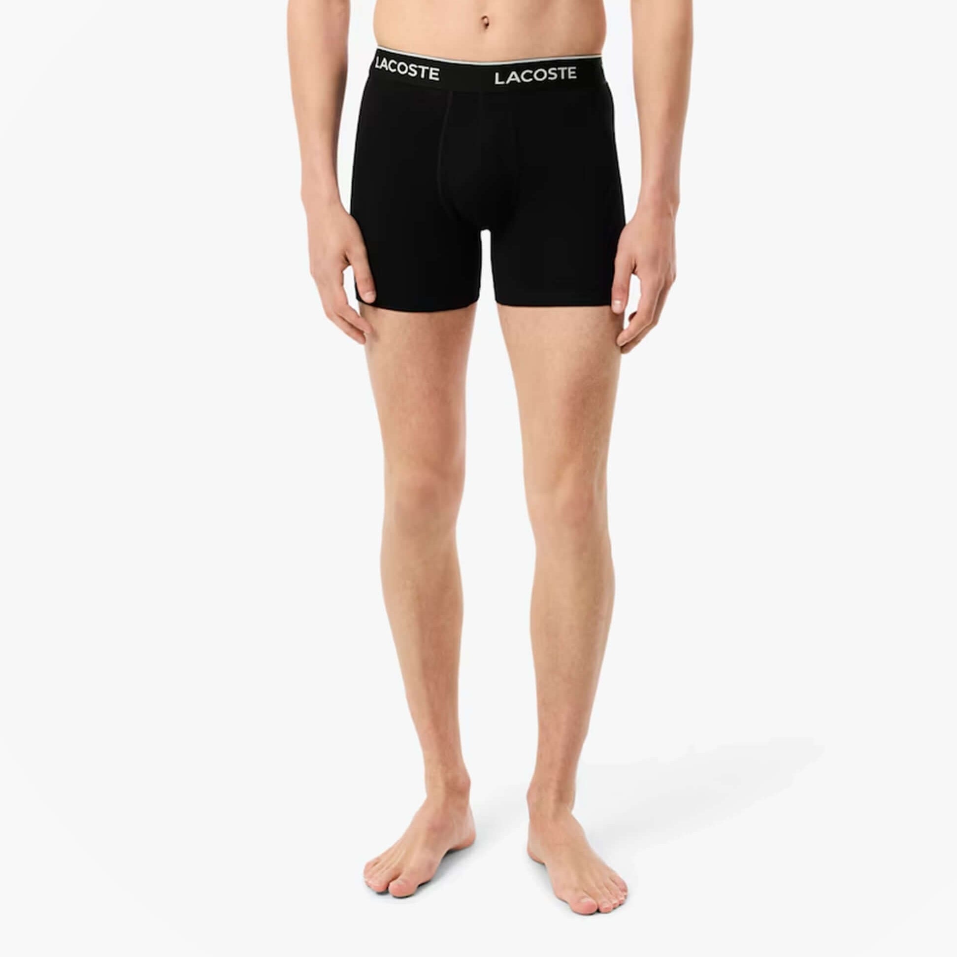 Lacoste 3 Pack Boxer Briefs Mens Boxer Briefs Black/White/Silver Chine front view on model displaying black briefs with logo.