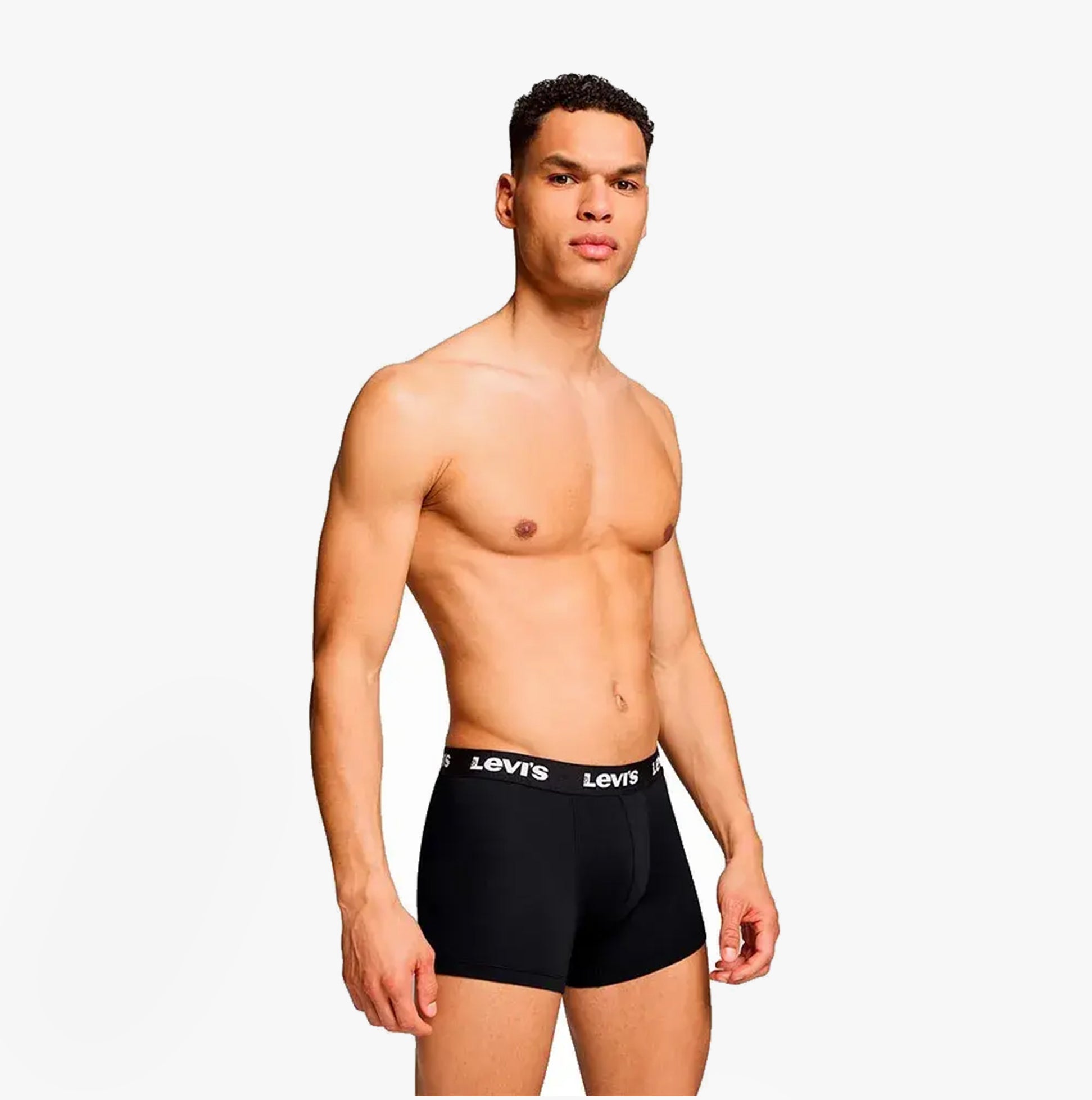 Levi's REPEAT LOGO Mens 2 Pack Trunks Black side view on a model showcasing the elastic waistband and fit.