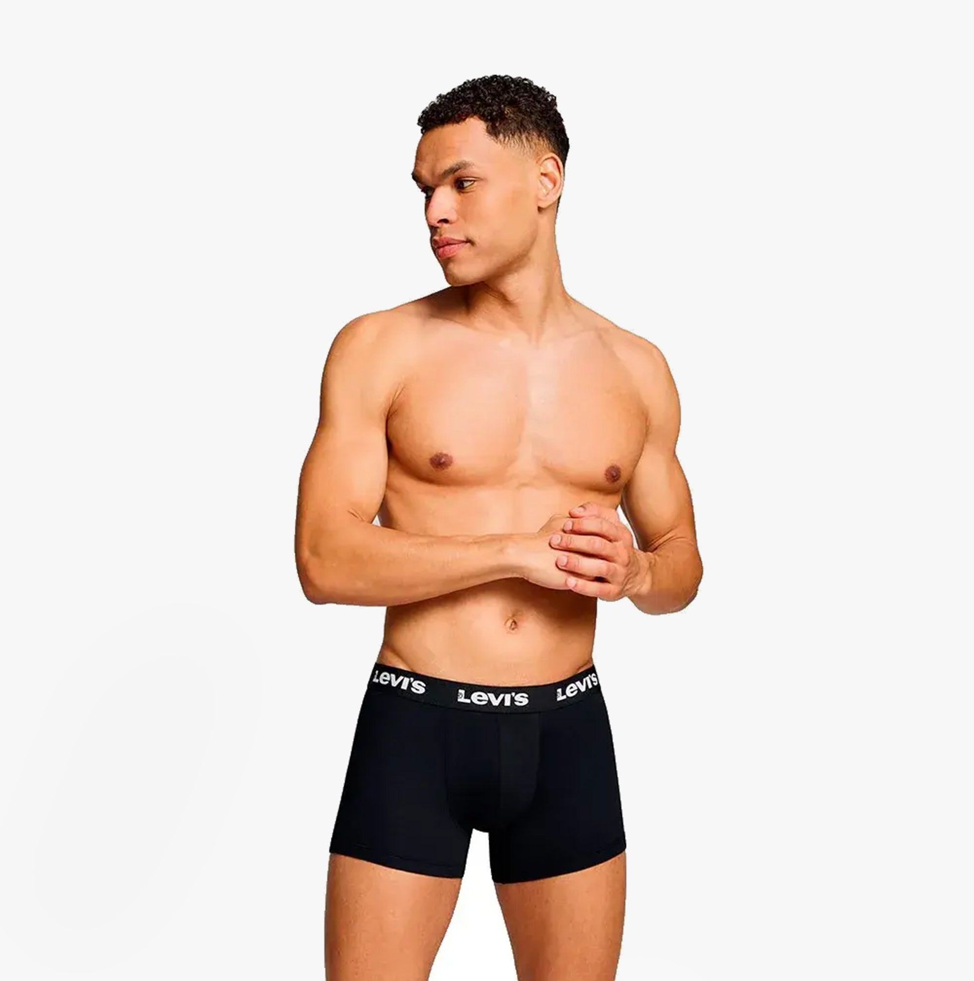 Levi's REPEAT LOGO Mens 2 Pack Trunks Black front view on model showcasing elastic waistband and ergonomic pouch.