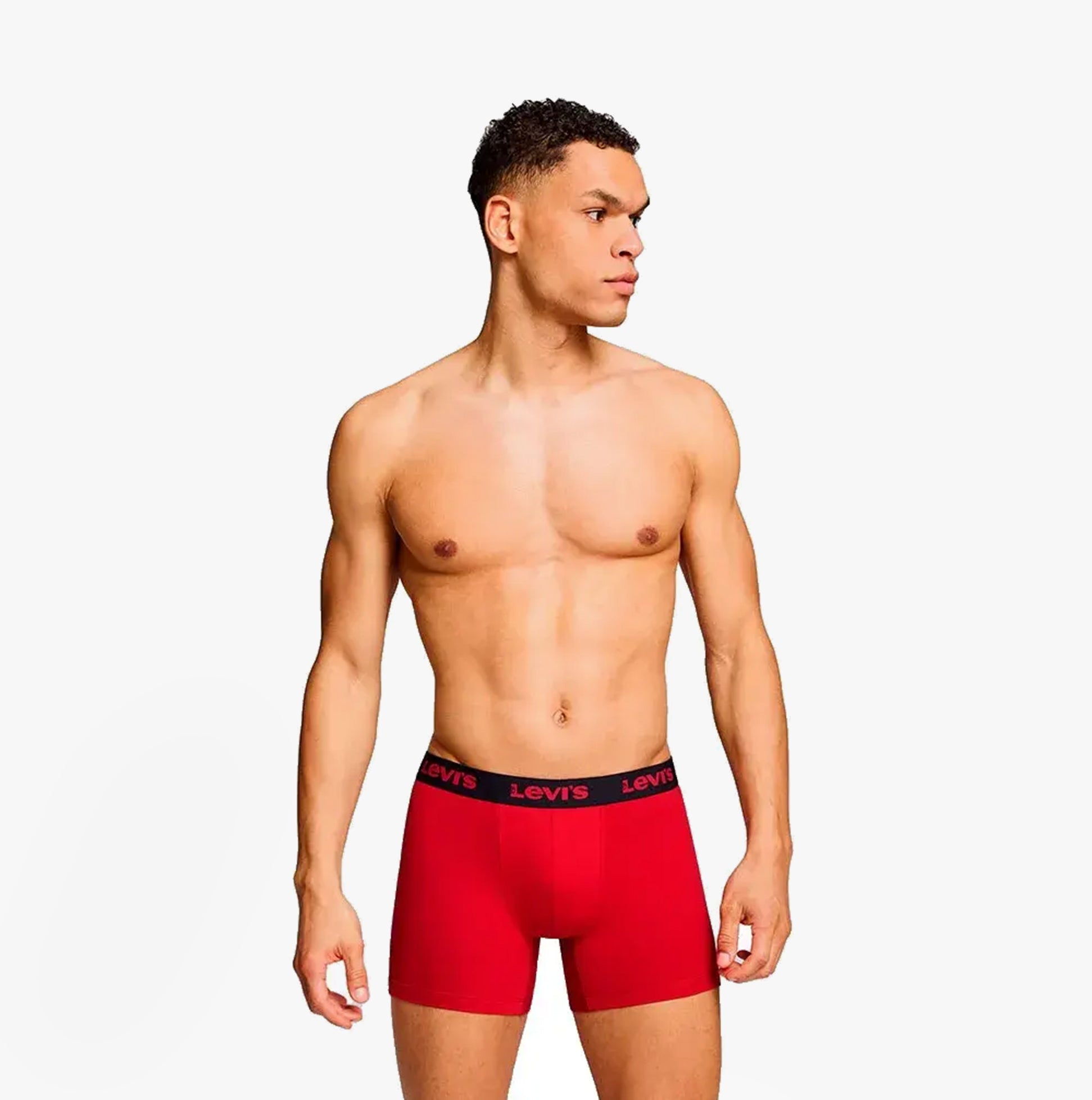 Levi's REPEAT LOGO Mens 2 Pack Trunks Red Combo side view on model showcasing elastic waistband with logo.