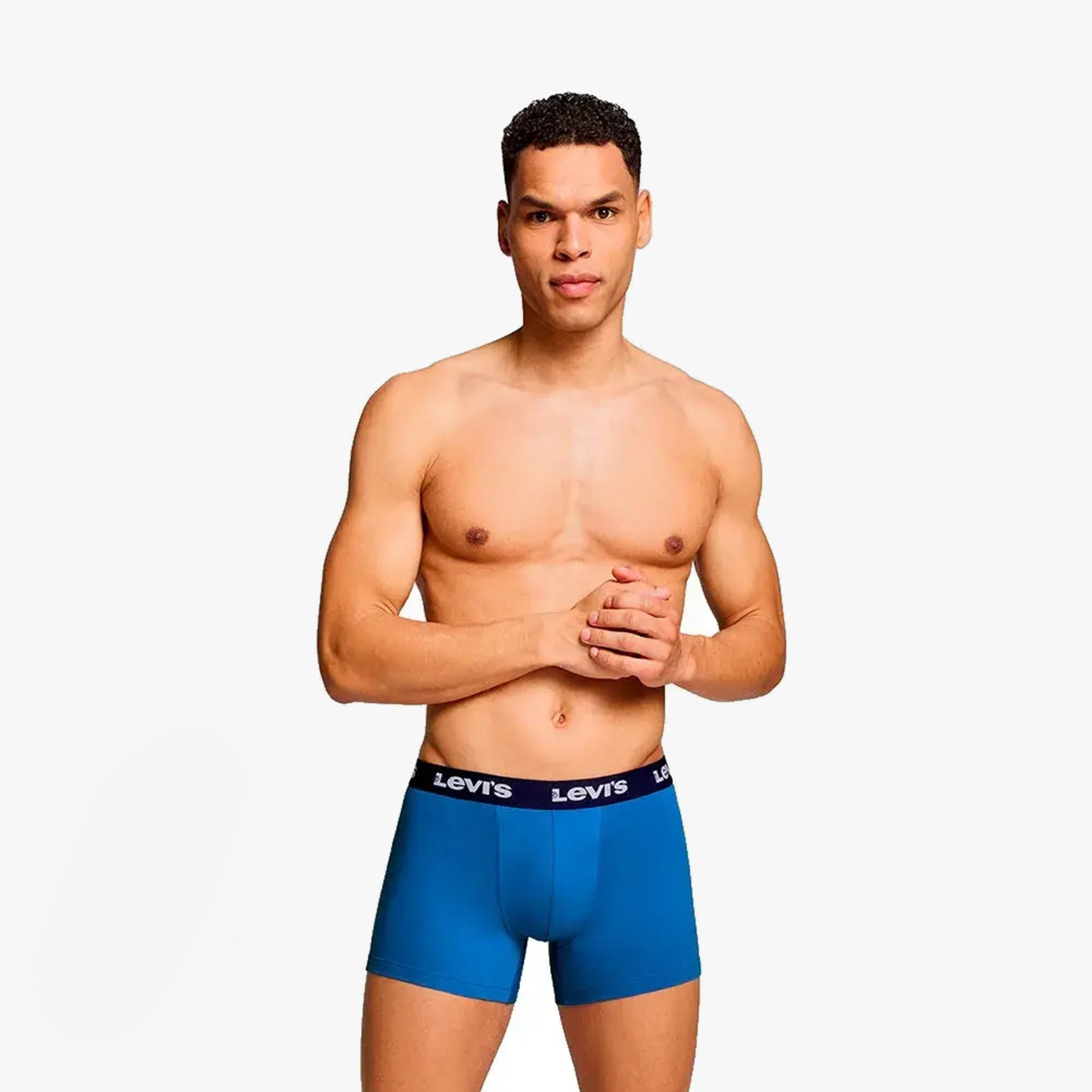 Levi's REPEAT LOGO Mens 2 Pack Trunks Blue Combo front view on model showing elastic waistband and ergonomic pouch.
