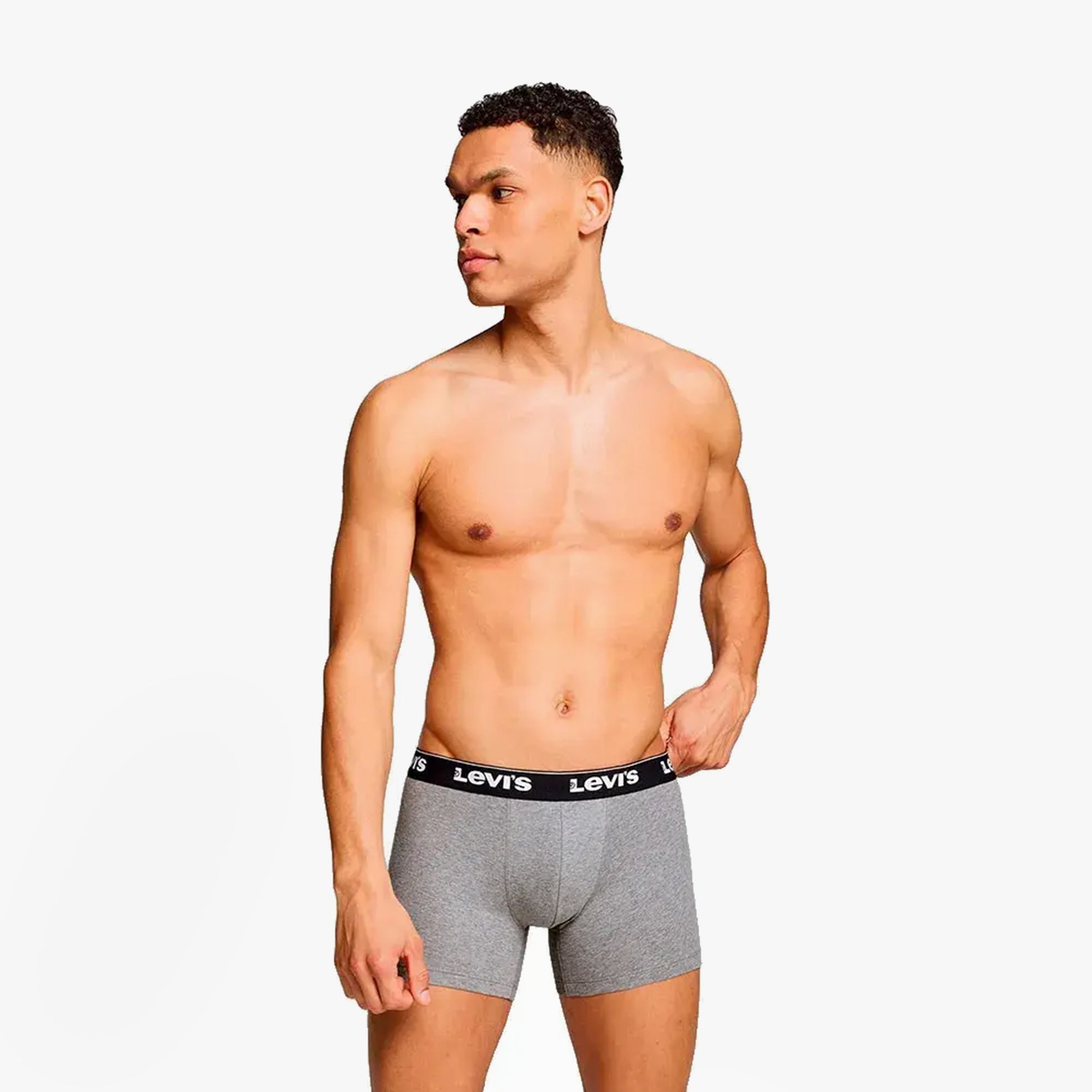 Levi's REPEAT LOGO Mens 3 Pack Trunks Grey Combo side view model wearing grey trunks with elastic waistband.