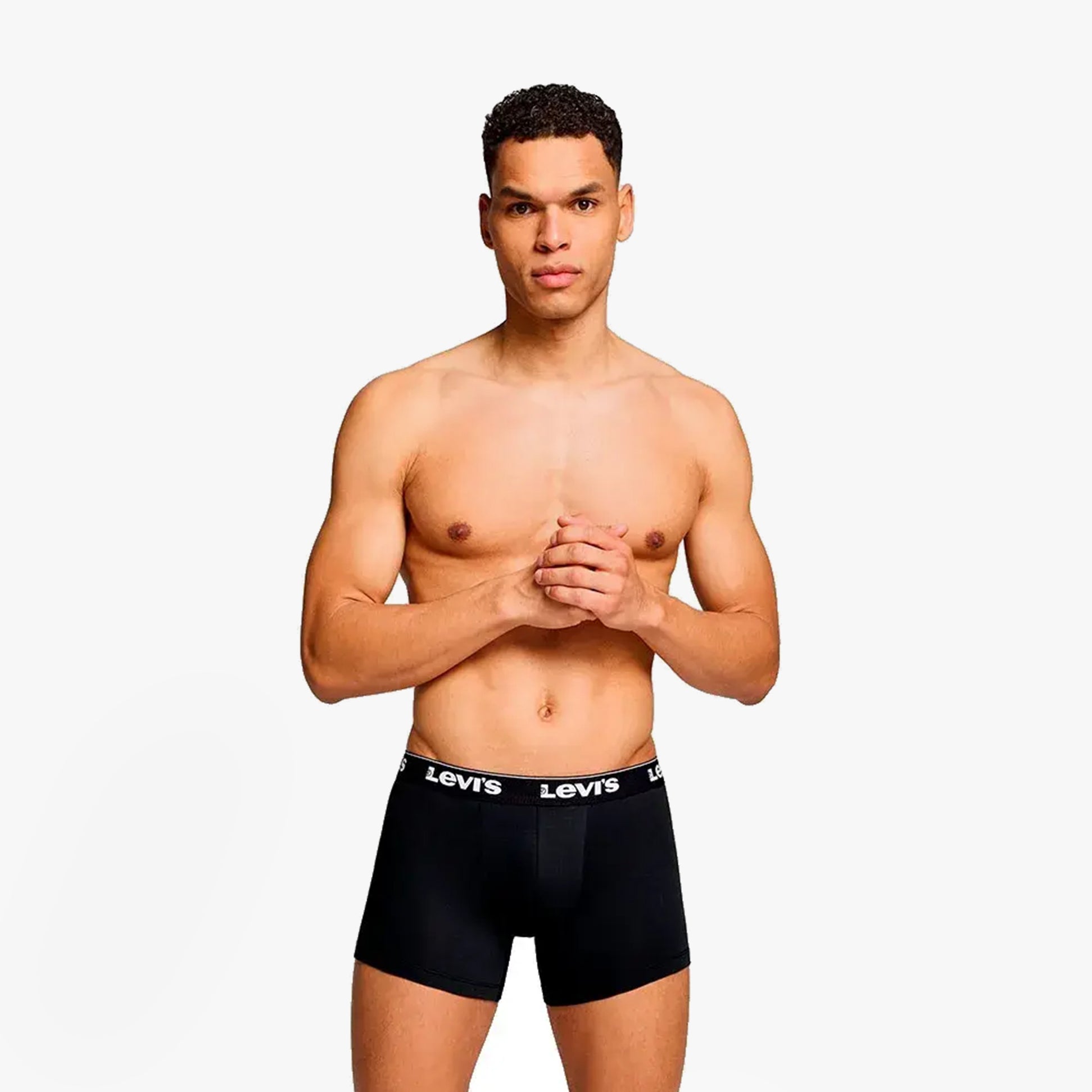 Levi's REPEAT LOGO Mens 3 Pack Trunks Khaki Combo front view featuring model wearing black trunks with Levi's logo waistband.