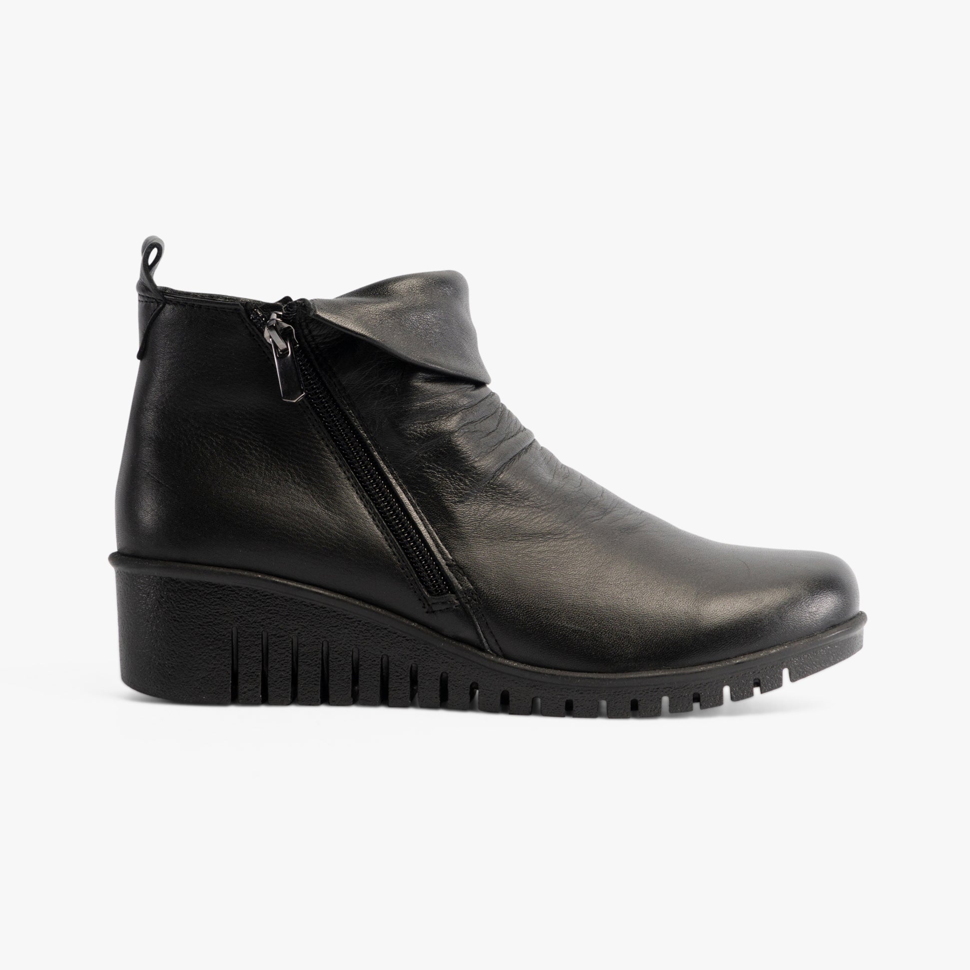 Lotus CORDELIA Womens Boots Black side view showcasing leather ankle boots with wedge heel and zip closure.