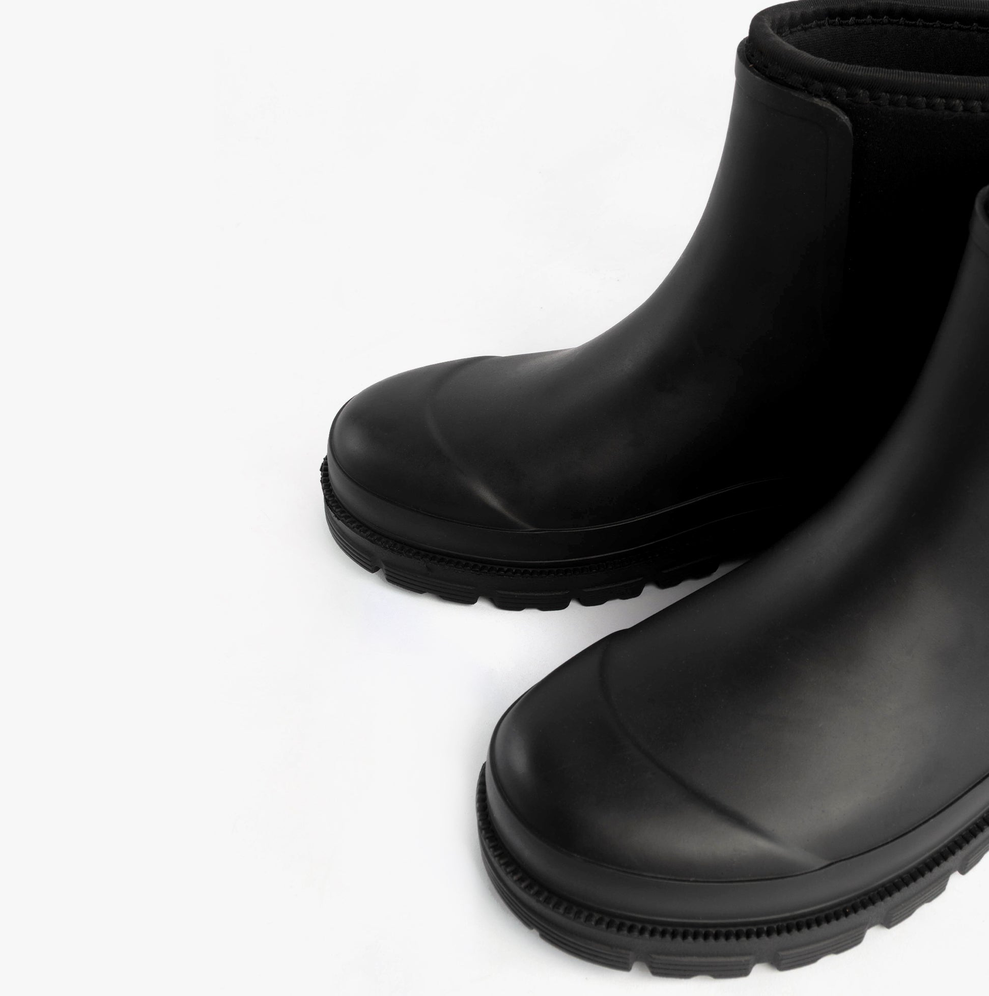 Mud Dogs BROOKE Womens Ankle Neoprene Wellies Black side view showing the sleek black design and rubber sole features.
