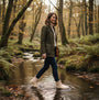 Mud Dogs BROOKE Womens Ankle Neoprene Wellies Mushroom worn by a woman walking through a stream in a forest.