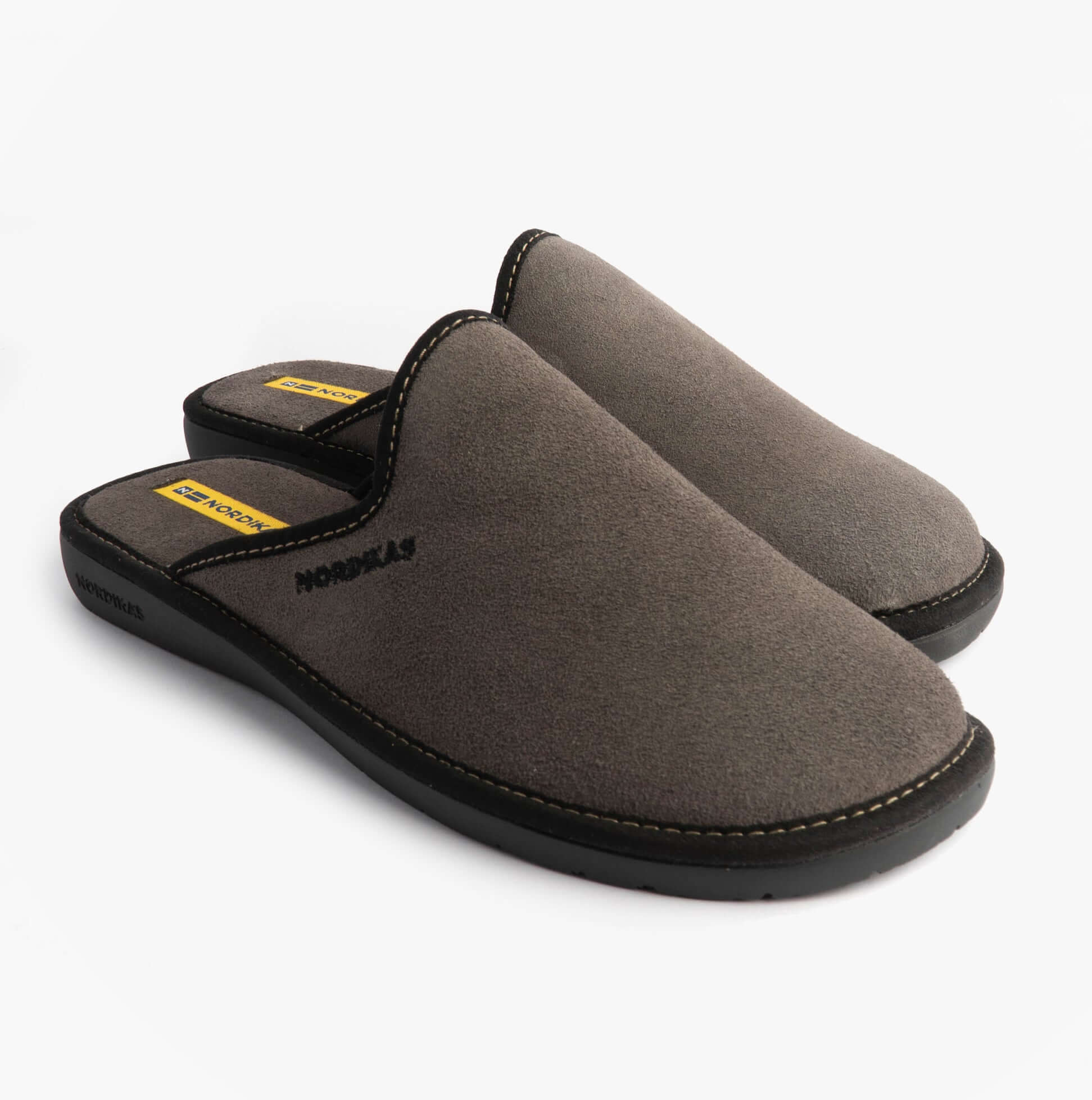 Nordikas 131 Mens Suede Mule Slippers Grey side view showing soft suede material and comfortable slip-on design.