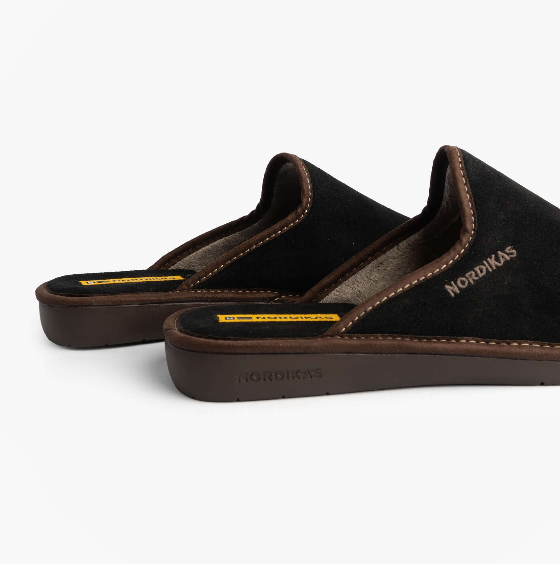 Nordikas 131 Mens Suede Mule Slippers Black side view showcasing the soft suede upper and comfortable slip-on design.