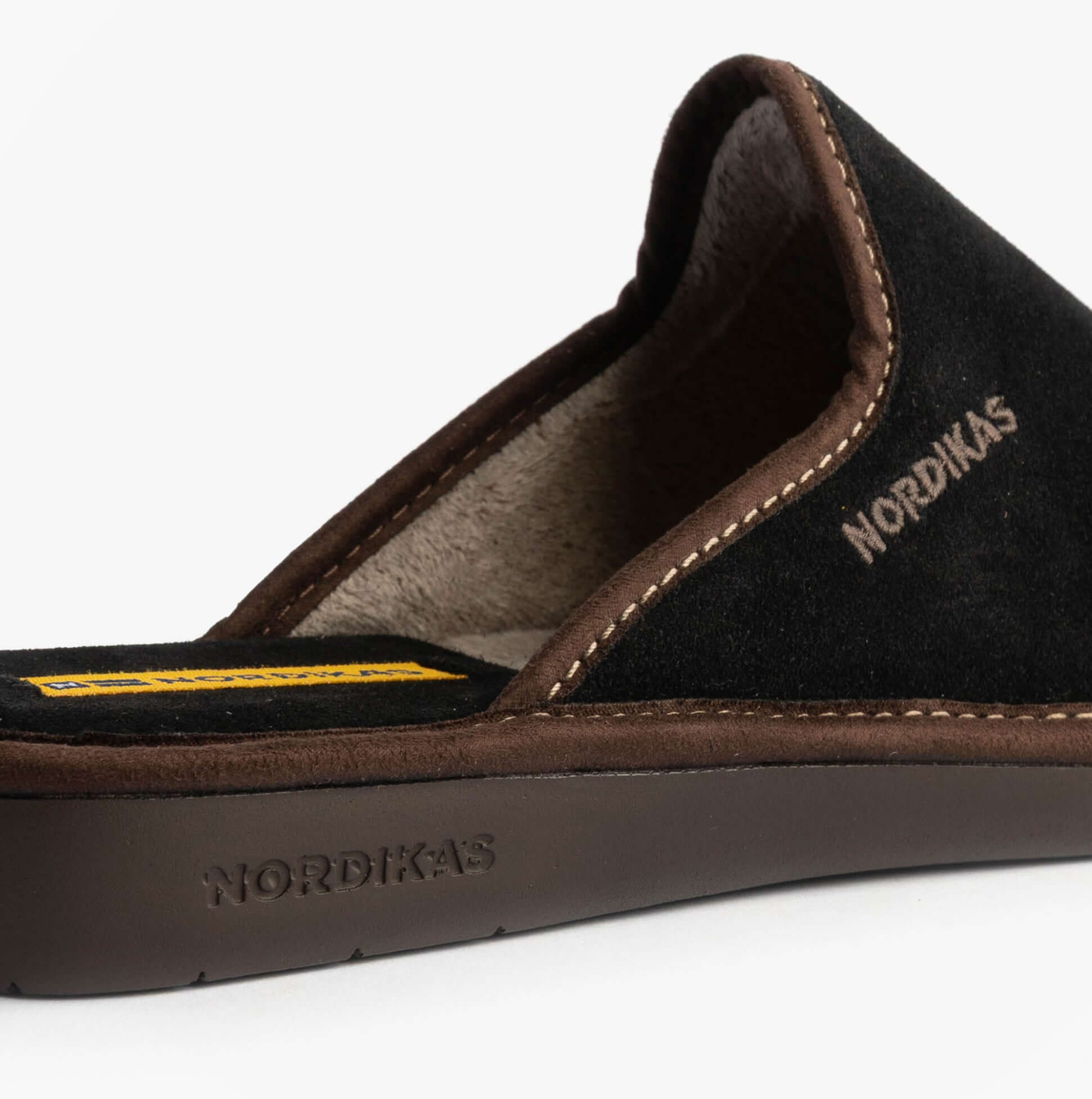 Nordikas 131 Mens Suede Mule Slippers Black side view showing suede upper and rubber sole detail.