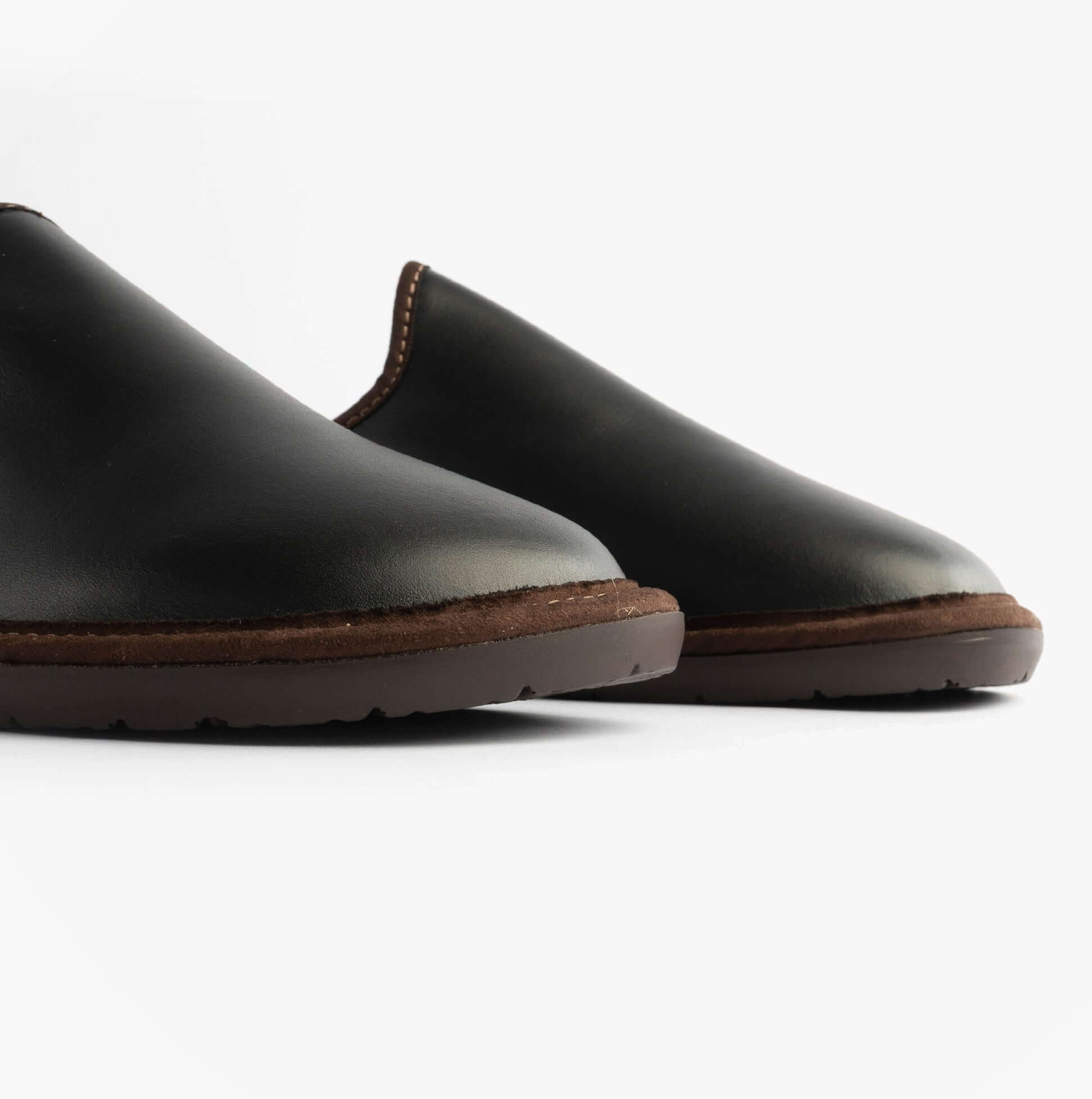 Nordikas 131 Mens Leather Mule Slippers Black side view showing premium leather upper and comfortable slip-on design.