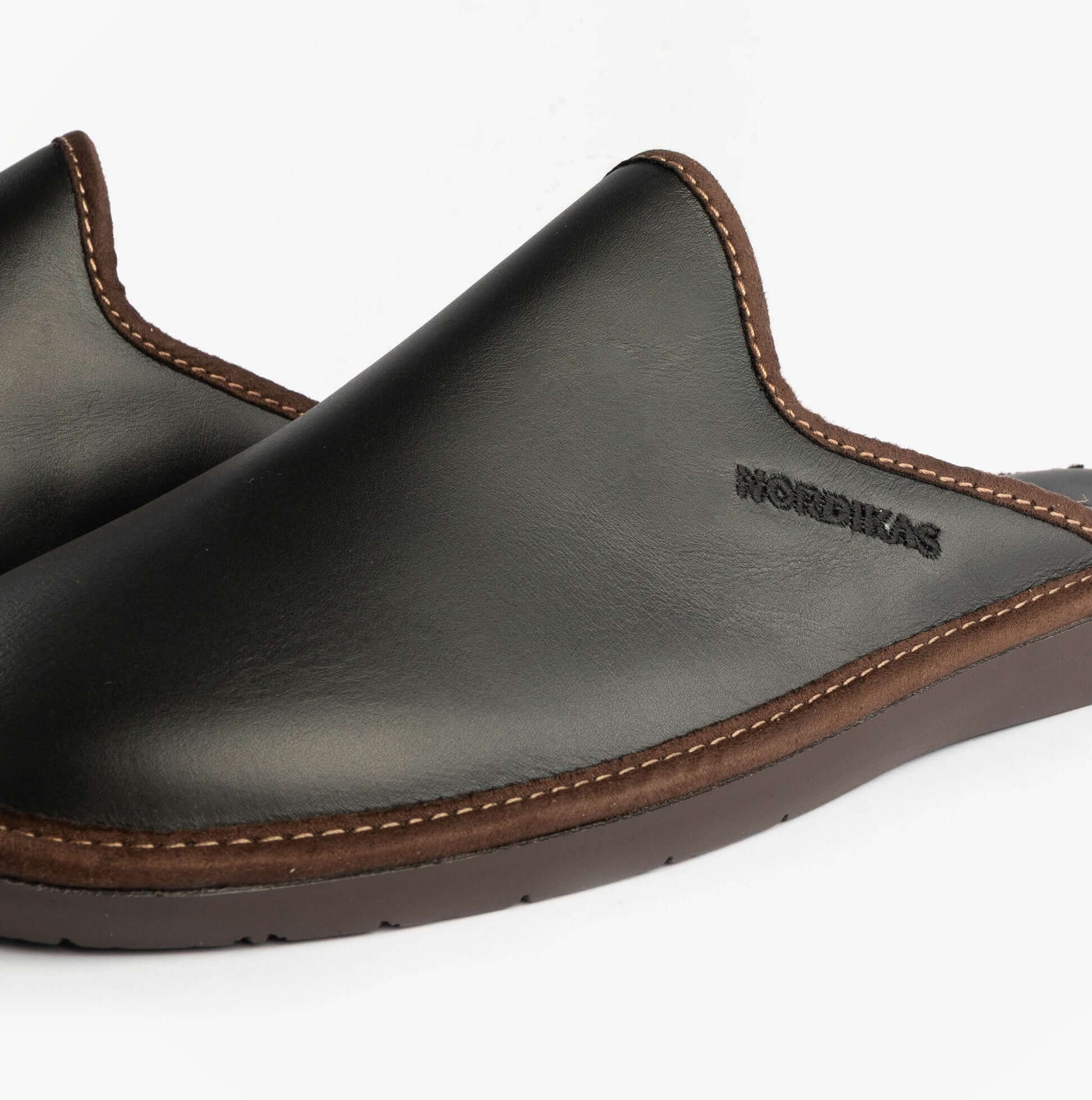 Nordikas 131 Mens Leather Mule Slippers Black side view showcasing premium leather design and comfortable slip-on style.