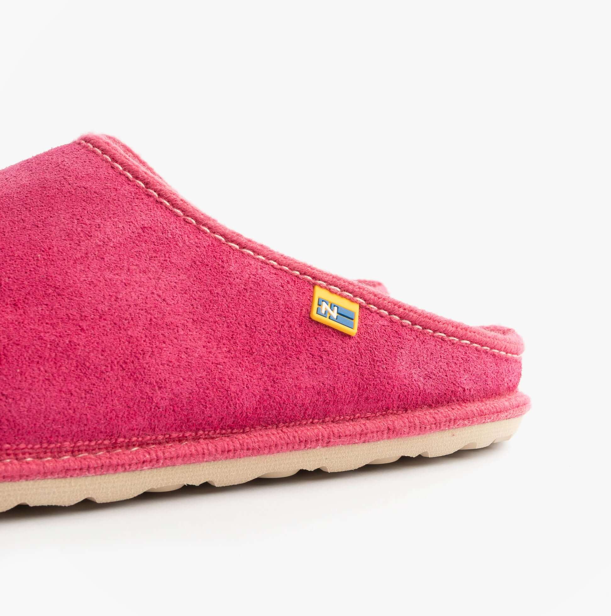 Nordikas 2083 Womens Fur Lined Mule Slippers Pink side view showing suede upper and rubber sole detail.