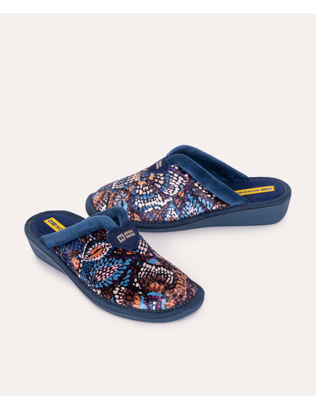 Nordikas 2155 Womens Mule Slippers Multi side view showing colorful textile upper and blue lining.