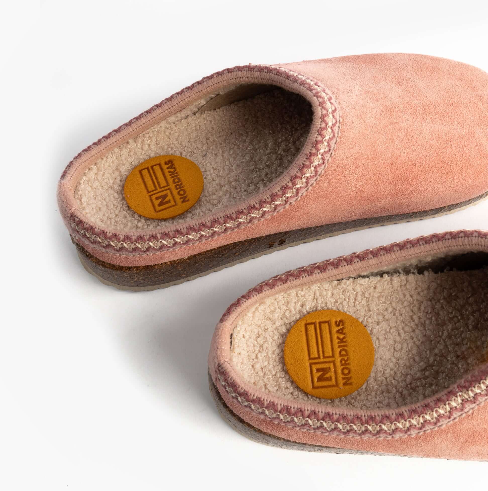 Nordikas 2247 Womens Suede Mule Slippers Rose Pink side view showcasing soft suede material and plush lining.