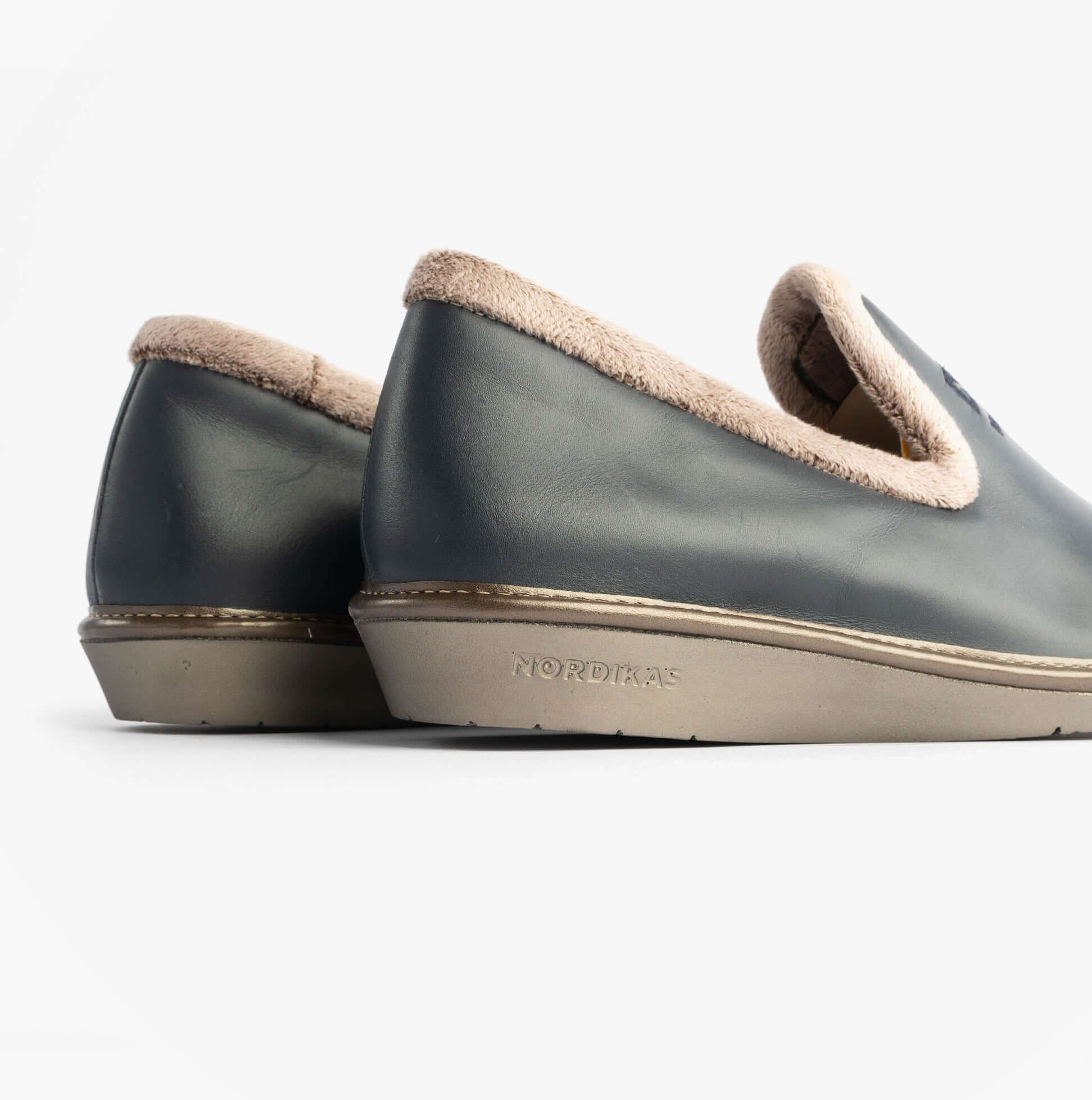 Nordikas 305 Womens Leather Full Slippers Marine Blue side view showcasing the smooth leather and plush lining.