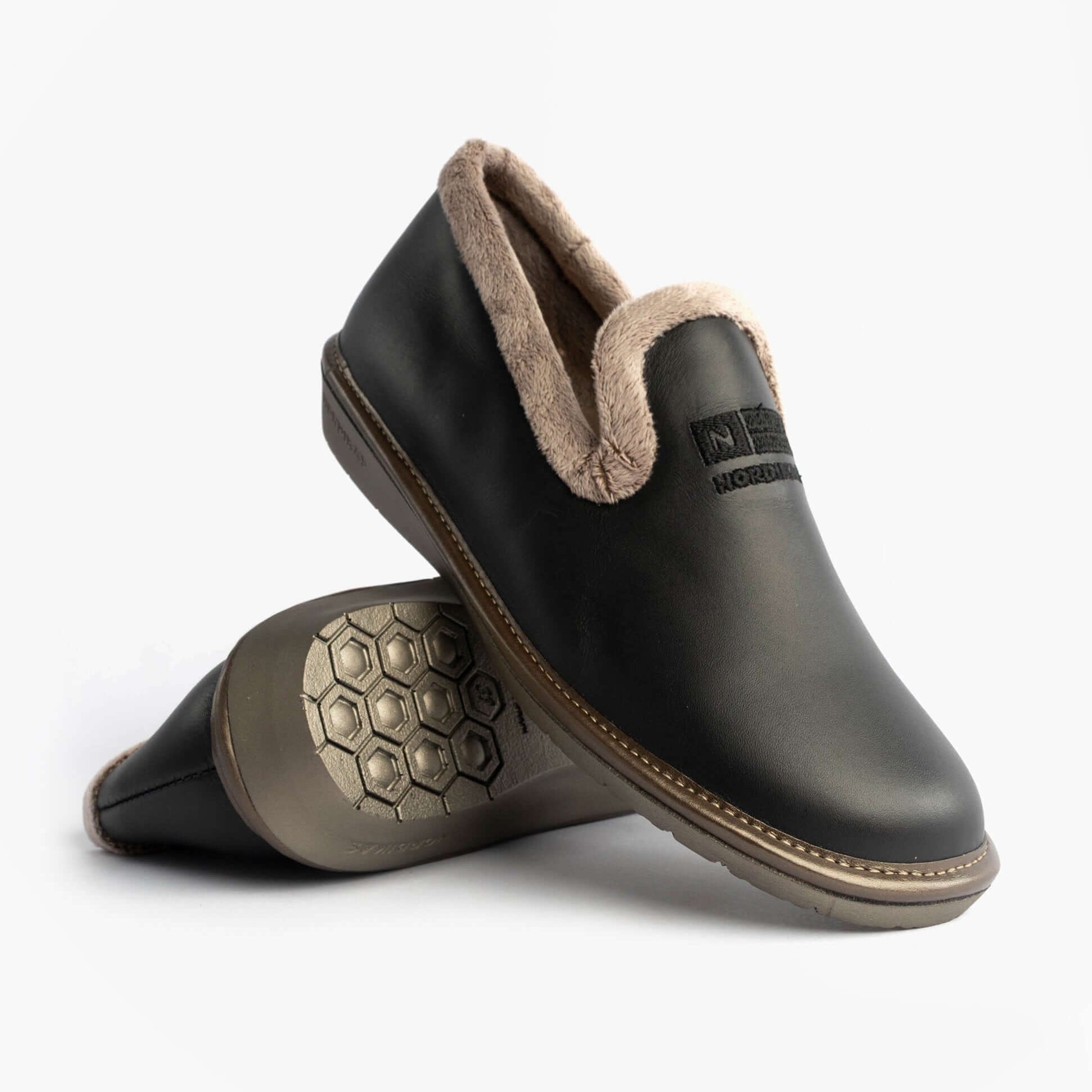 Nordikas 305 Womens Leather Full Slippers Black side view showcasing soft lining and rubber sole.