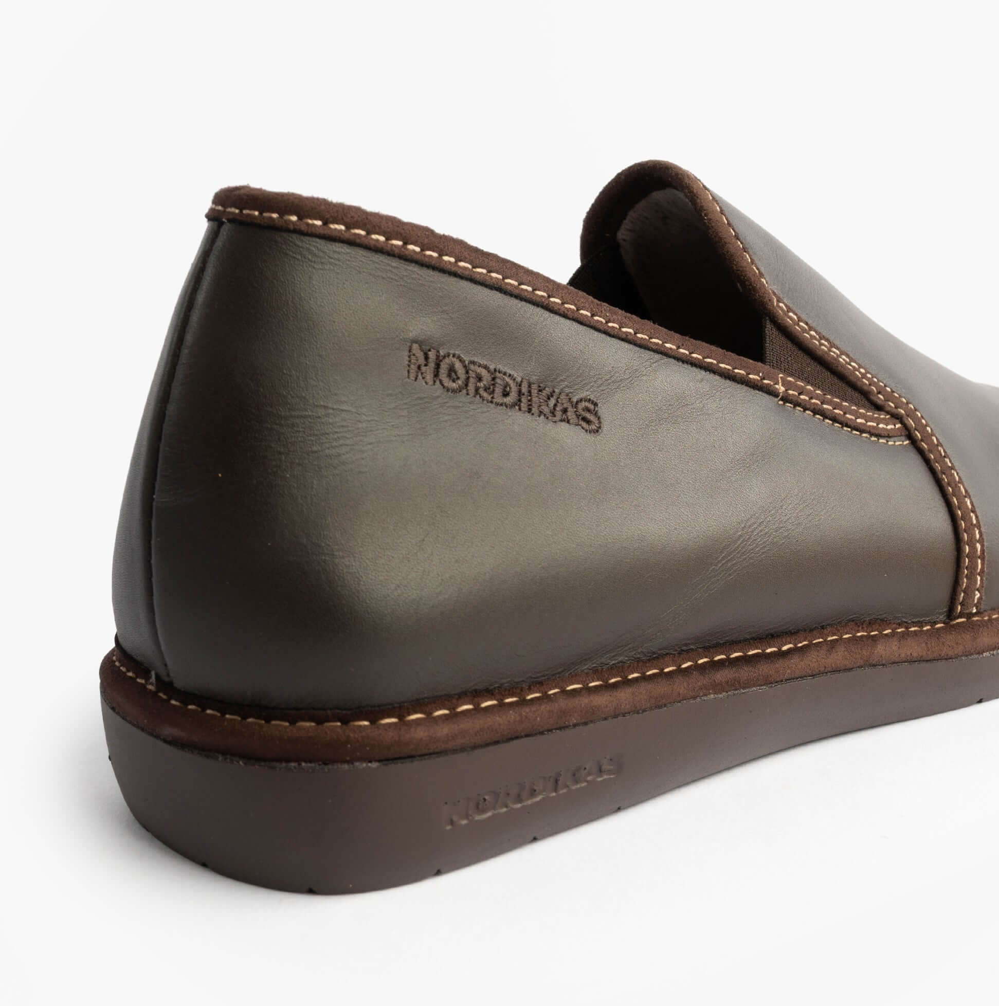 Nordikas 663 Mens Leather Full Slippers Mocha side view showcasing premium leather finish and low top design.