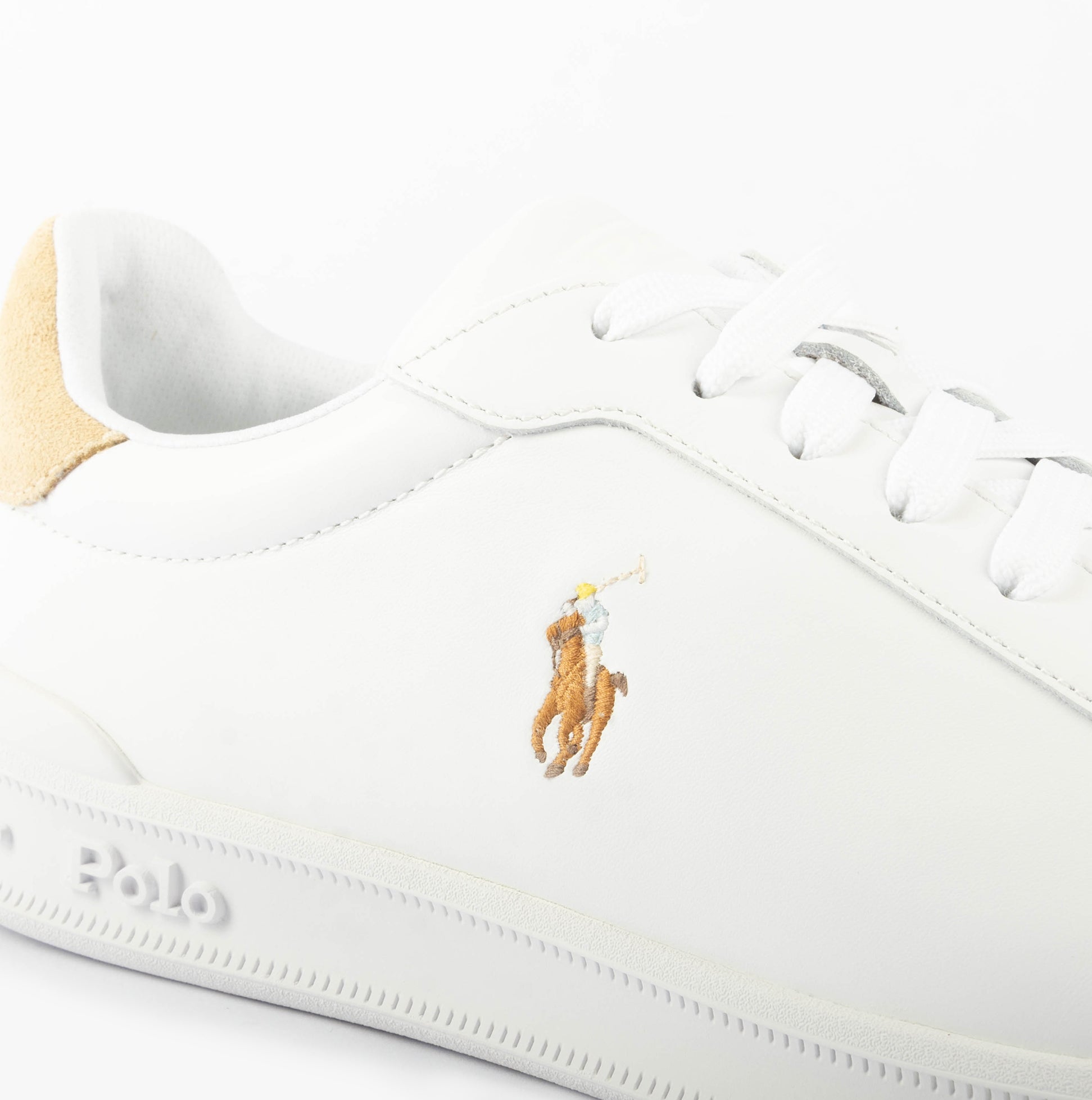 Polo Ralph Lauren HERITAGE COURT II Mens Trainers White/Bone detail view featuring the logo and shoe material.