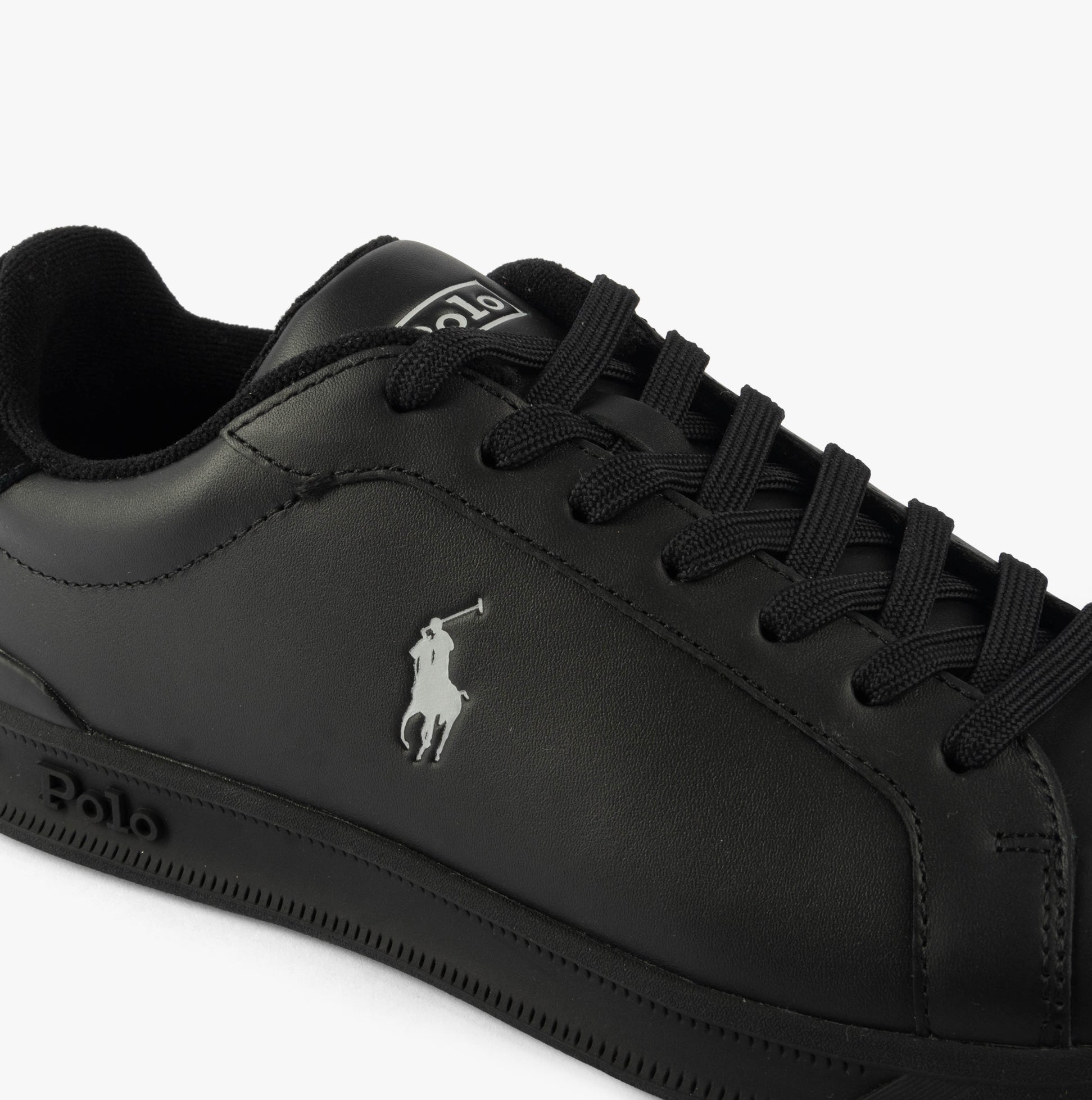 Polo Ralph Lauren HERITAGE COURT II Mens Trainers Black/Soft Grey close-up view featuring black leather upper and lace-up detail.