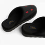 Polo Ralph Lauren READE Suede-Trim Polo Pony Scuff Mule Slipper side view showing logo and detailing in black.