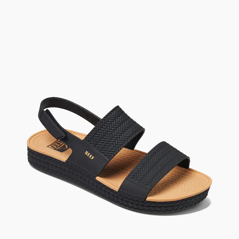 Reef WATER VISTA Womens Sandals Black/Tan side view showcasing synthetic upper, EVA lining, and low heel.