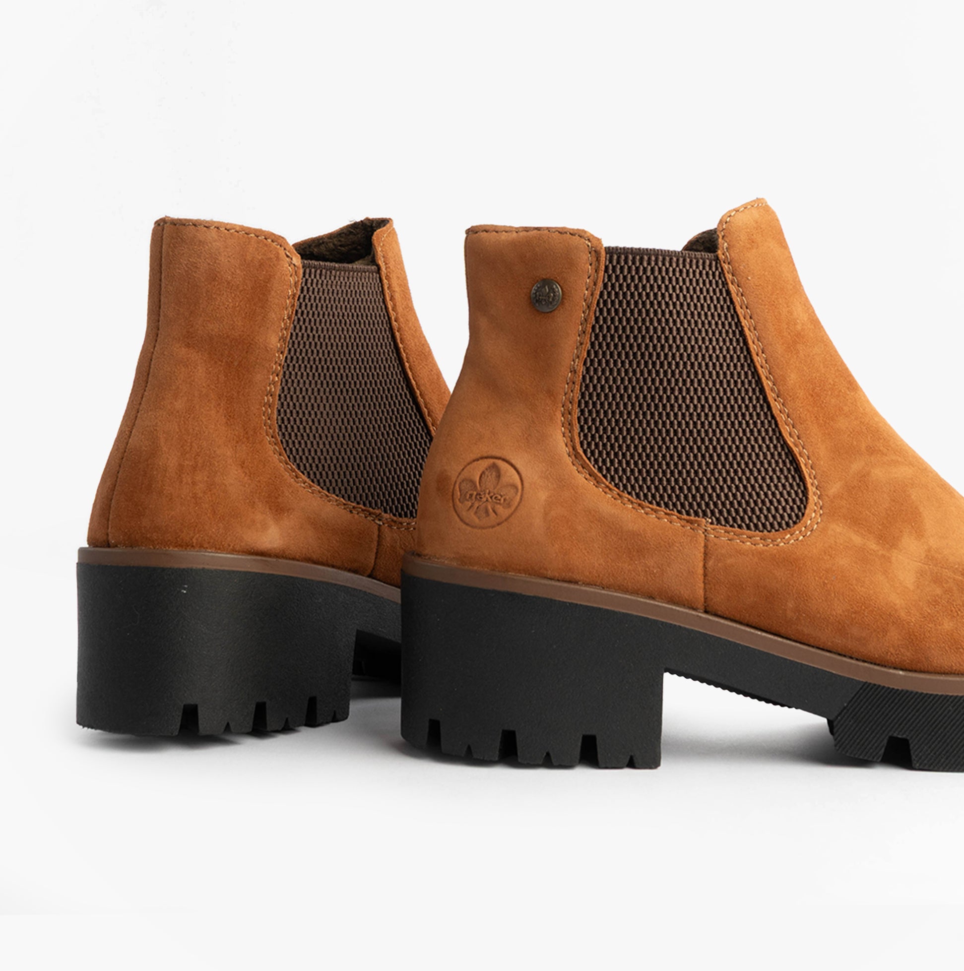 Rieker 79265-22 Womens Boots Brown side view featuring soft leather, breathable mesh, and chunky rubber sole.