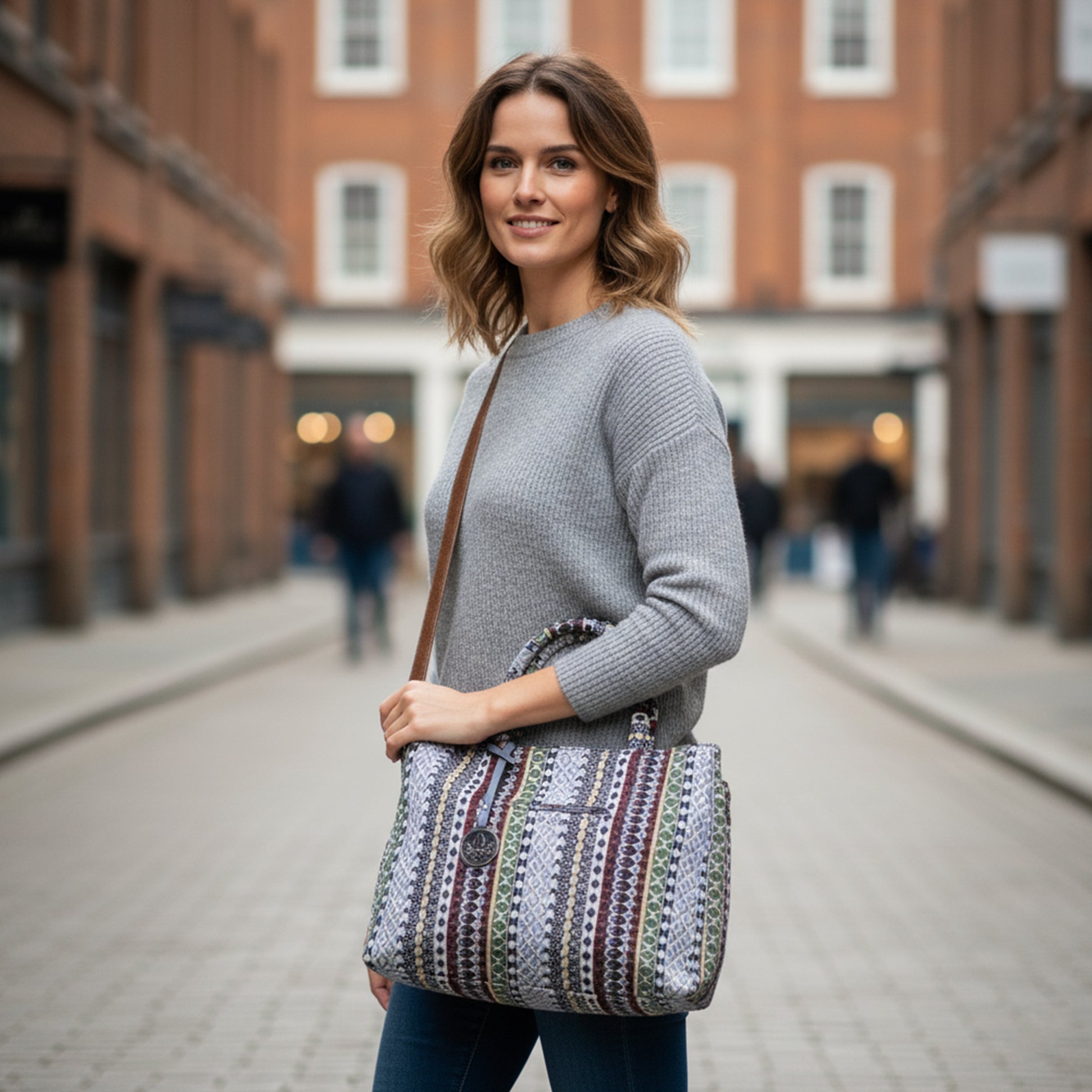 Rieker H1511-95 Womens Shoulder Bag Multi displayed in front view, worn by a model on a street.