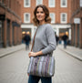 Rieker H1511-95 Womens Shoulder Bag Multi displayed in front view, worn by a model on a street.