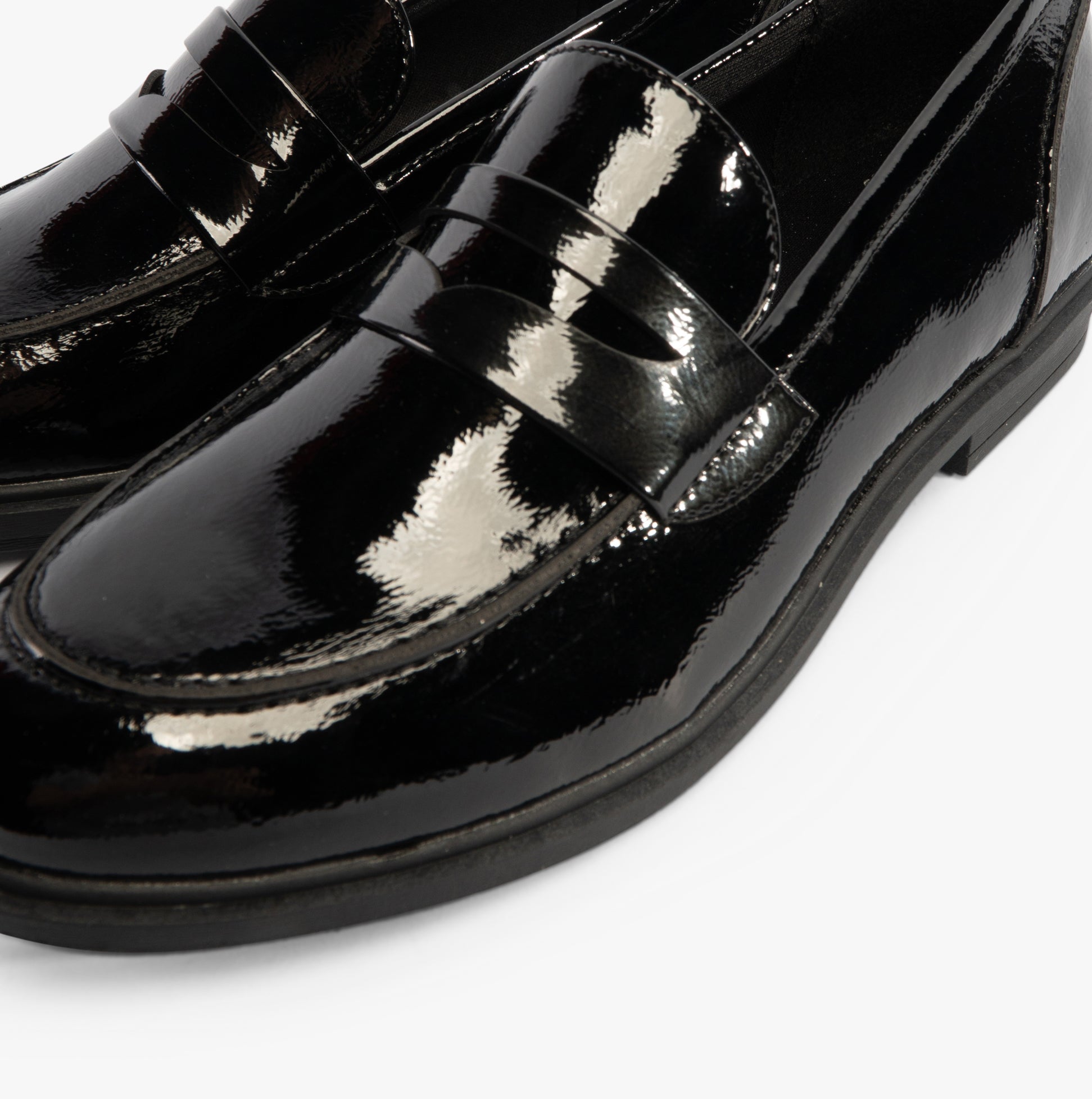 Rocket Dog GABBY Womens Shoes Black close-up detail view of shiny black loafer with stitched accents.