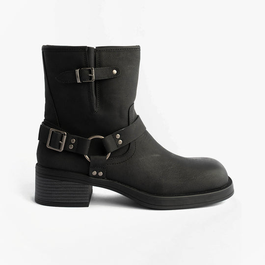 Rocket Dog NINO Womens Boots Black side view featuring faux leather upper and buckle details.