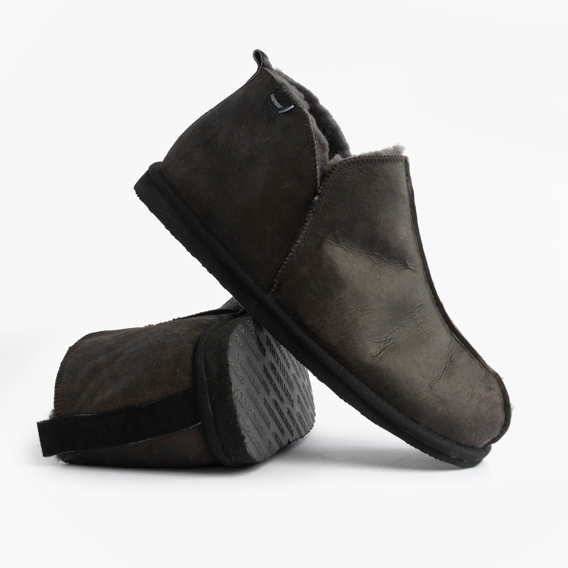 Shepherd ANTON Mens Slippers Matt Black side view showcasing leather/suede upper and rubber sole.
