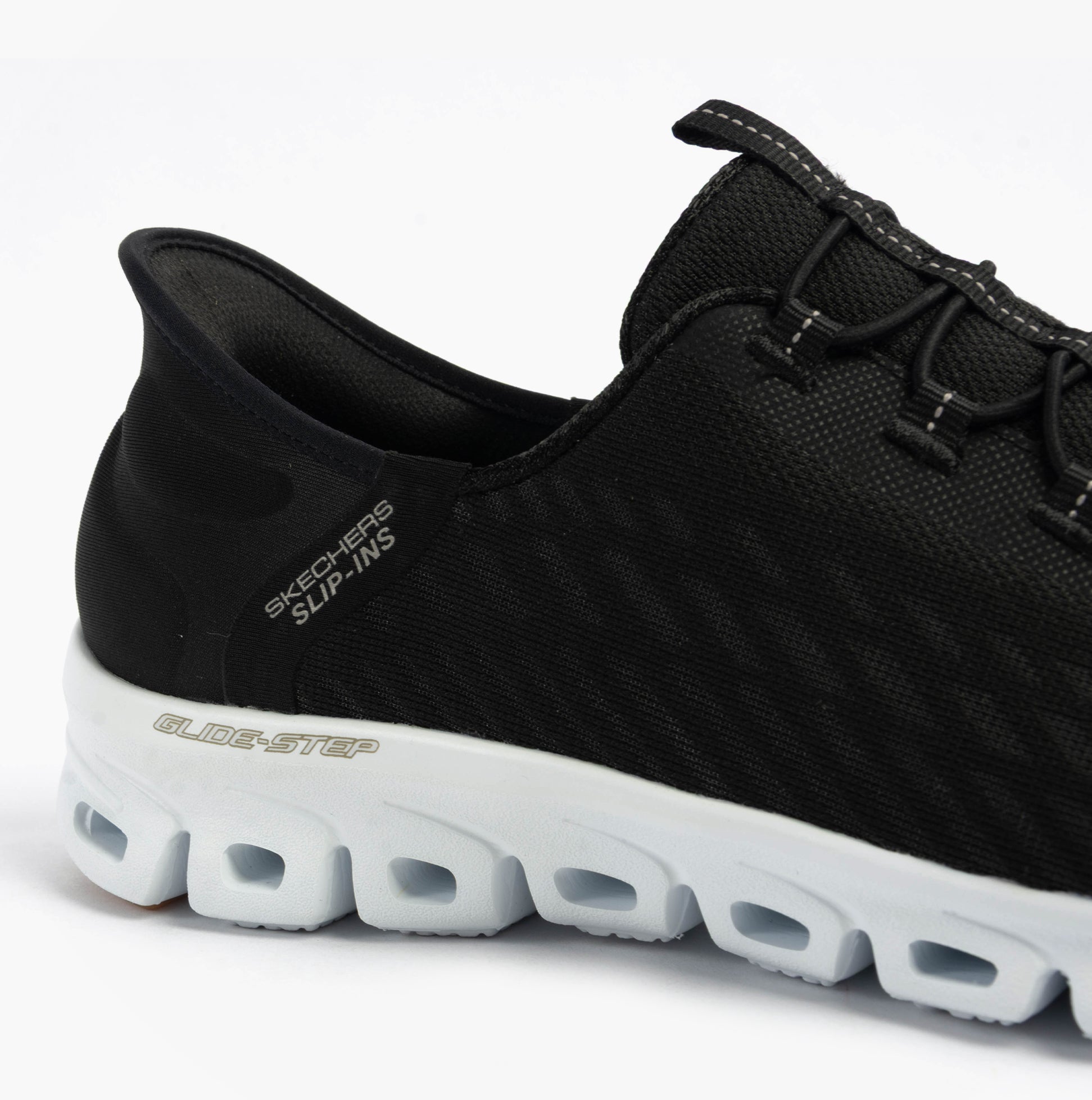 Skechers 104574/BKW GLIDE-STEP - TRANQUILITY Womens Trainers Black/White side view showcasing the mesh upper and rubber sole.