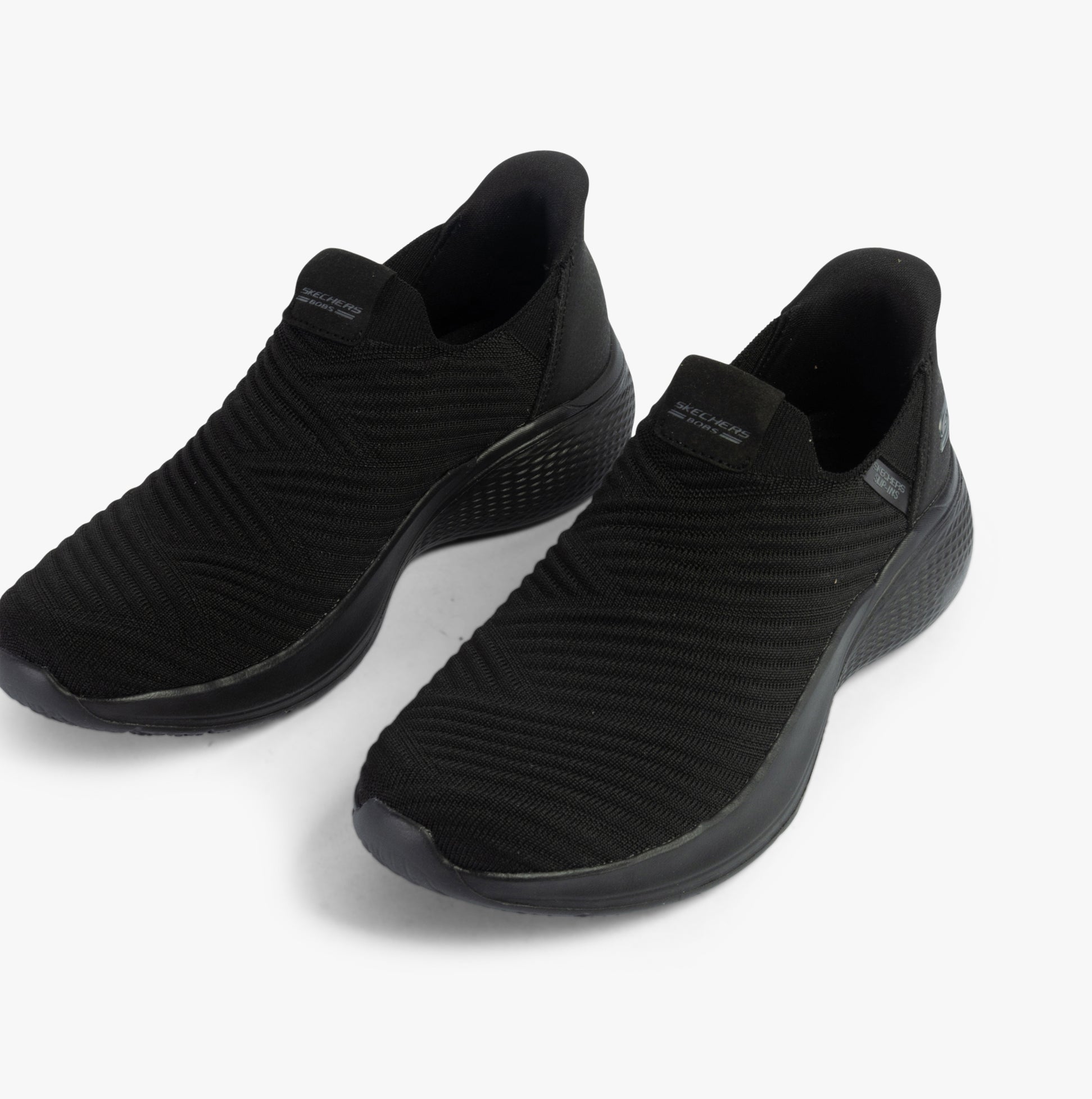 Skechers 117508/BBK BOBS INFINITY - DAILY VISION Womens Trainers Black side view showing slip-on design and synthetic upper.