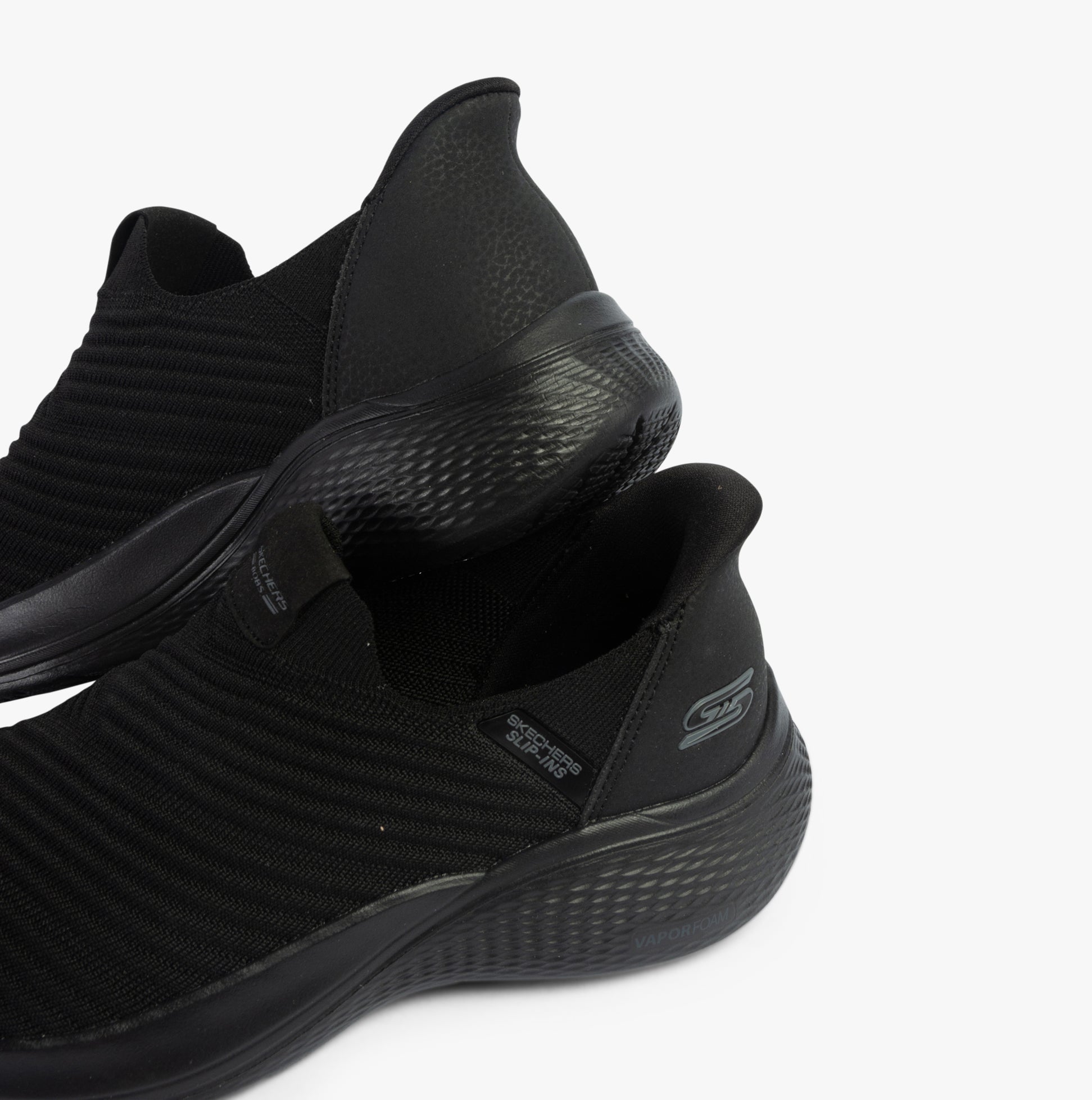 Skechers 117508/BBK BOBS INFINITY - DAILY VISION Womens Trainers Black side view showcasing synthetic mesh upper and slip-on design.