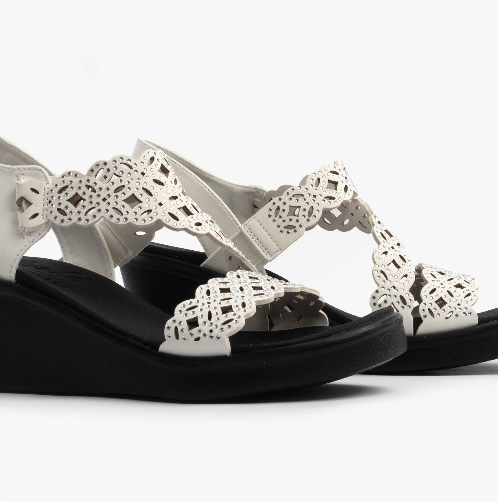 Skechers 119617/WHT RUMBLE ON - SASSIER DAYZ Womens Sandals White side view detailing the synthetic leather upper and wedge heel.