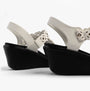 Skechers 119617/WHT RUMBLE ON - SASSIER DAYZ Womens Sandals White side view showing synthetic leather and wedge heel design.