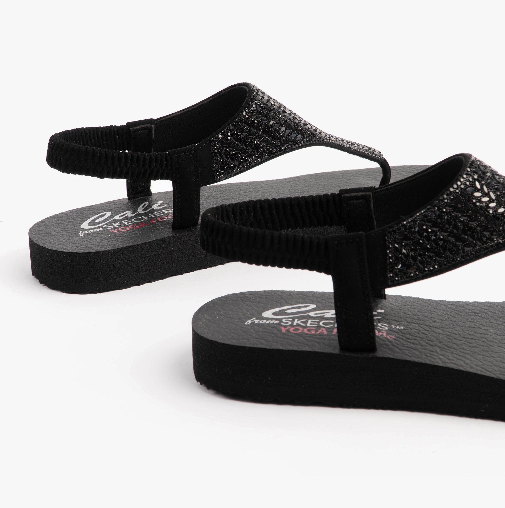 Skechers 119774/BBK MEDITATION - GLAMOROUS MUSE Womens Sandals Black side view showcasing the synthetic material and slip-on design.