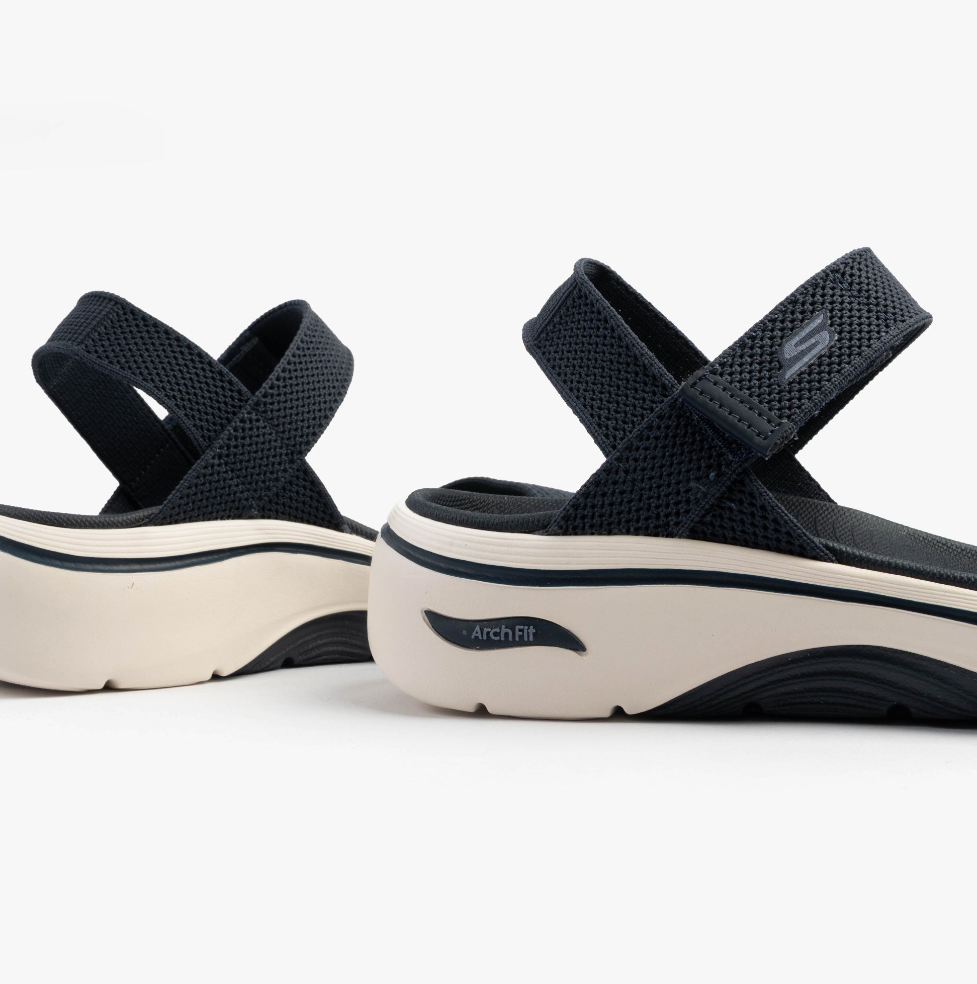 Skechers 140874/NVY GO WALK ARCH FIT 2.0 SANDAL - ANNIE Womens Sandals Navy side view, showcasing the breathable textile upper and rubber sole.