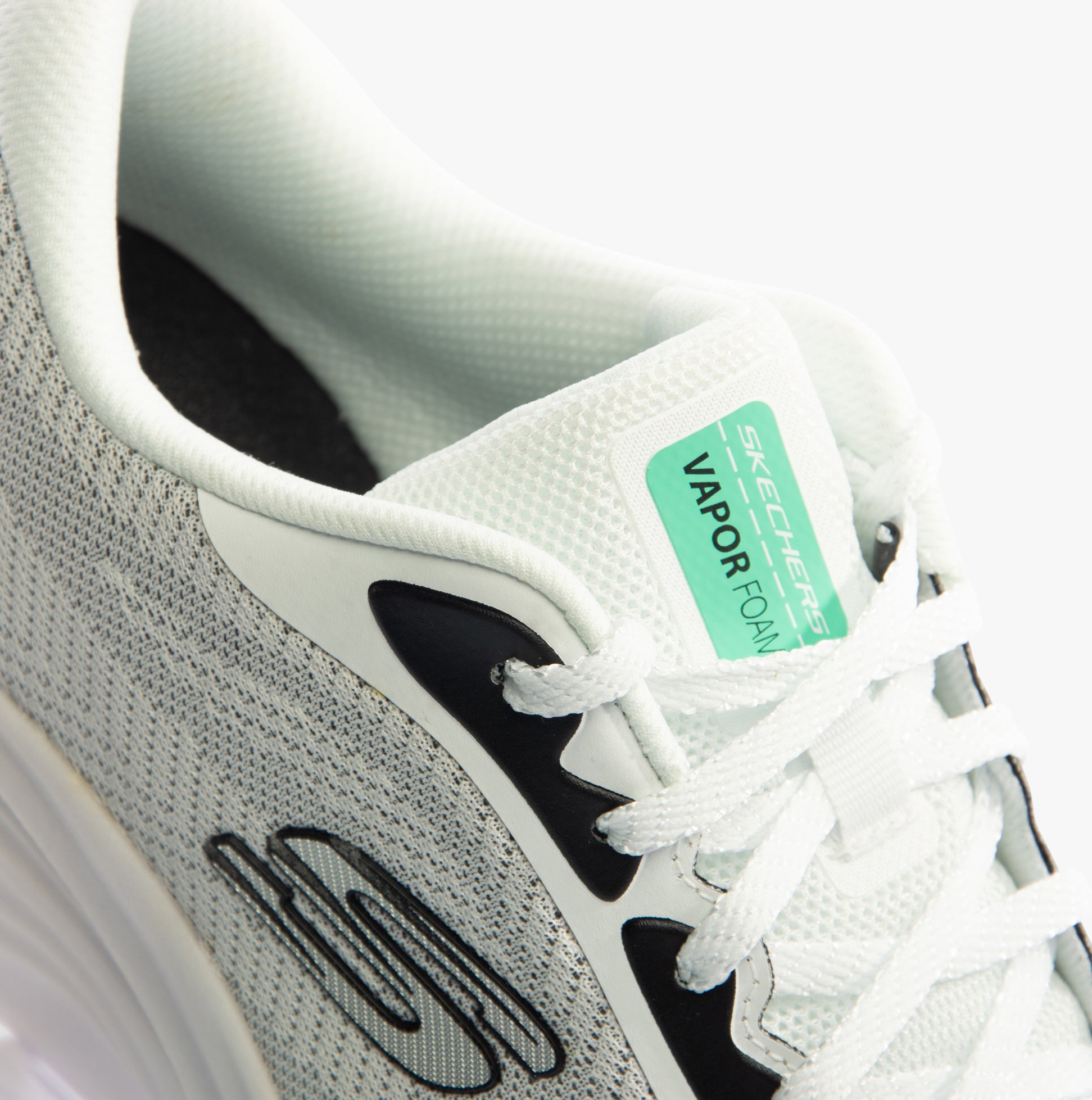 Skechers 150028/WBK VAPOR FOAM - SMOOTH RIDE Womens Trainers White/Black top view showcasing lace-up design and logo.