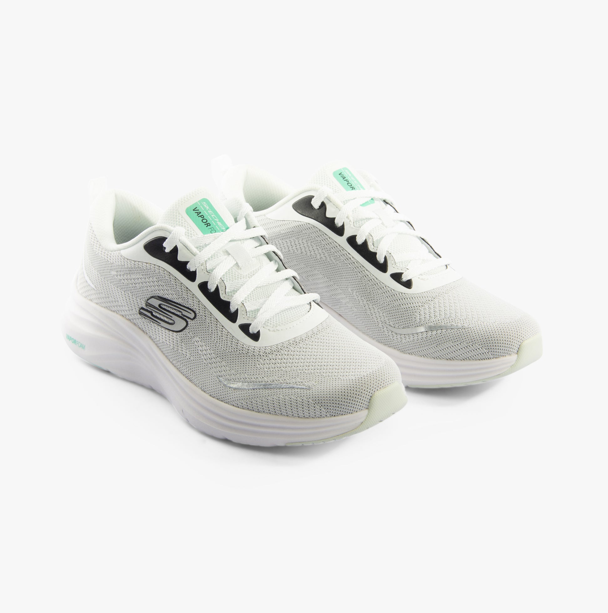Skechers 150028/WBK VAPOR FOAM - SMOOTH RIDE Womens Trainers White/Black, side view with lace-up closure and round toe.