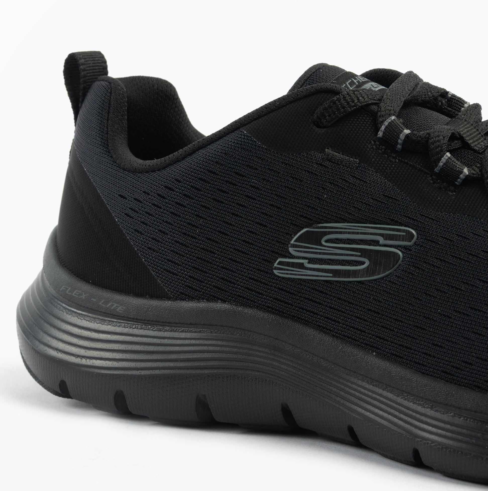 Skechers 150201/BBK FLEX APPEAL 5.0 Womens Trainers Black side view showcasing mesh upper and rubber sole.