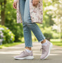 Skechers 150457/LTMV ULTRA FLEX 3.0-ELEVATED MOTION Womens Trainers Light Mauve side view with model wearing in a park.