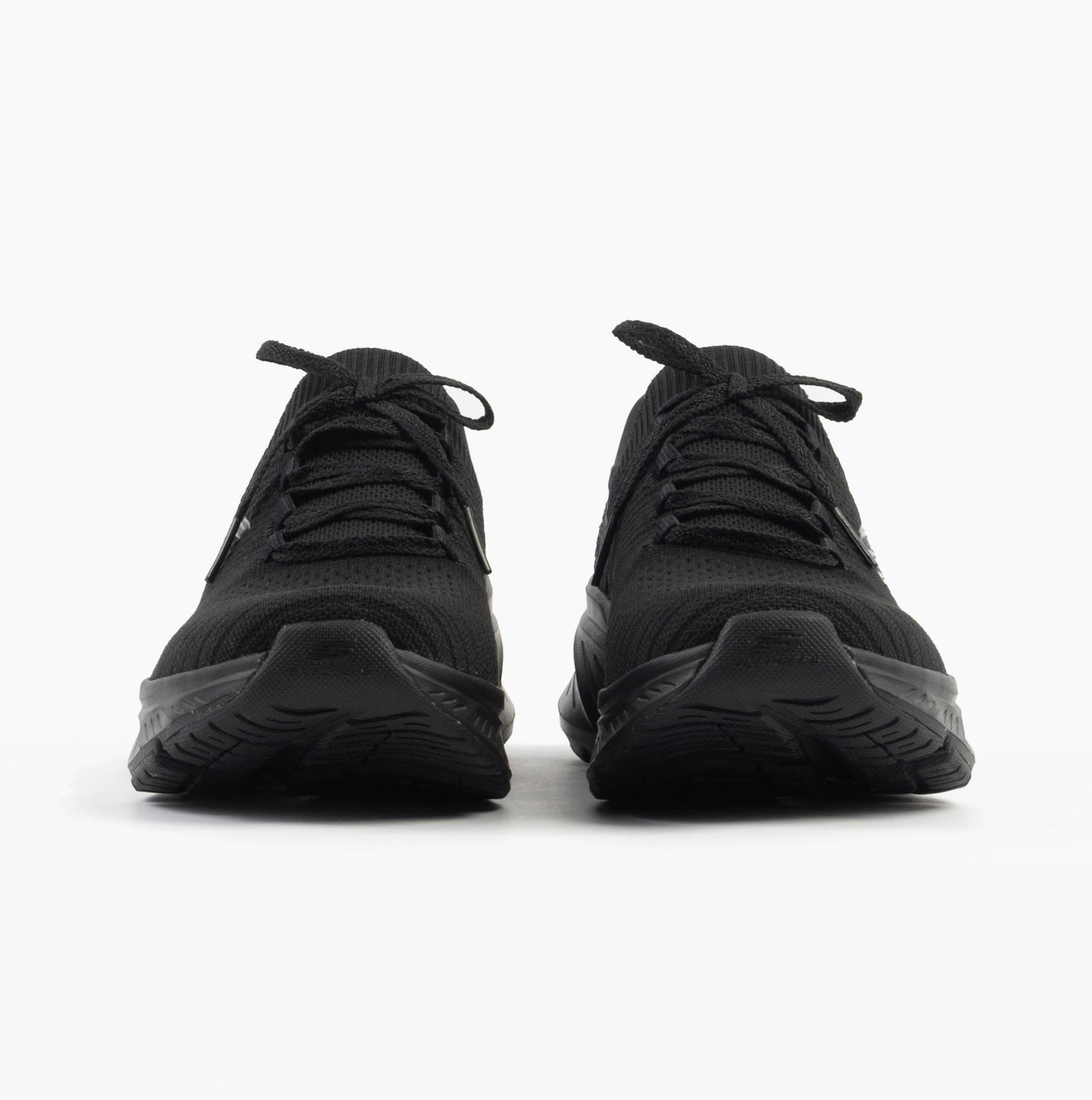 Skechers 150470/BBK EDGERIDE - IMPRESSION Womens Trainers Black front view, showcasing lace-up design and round toe.