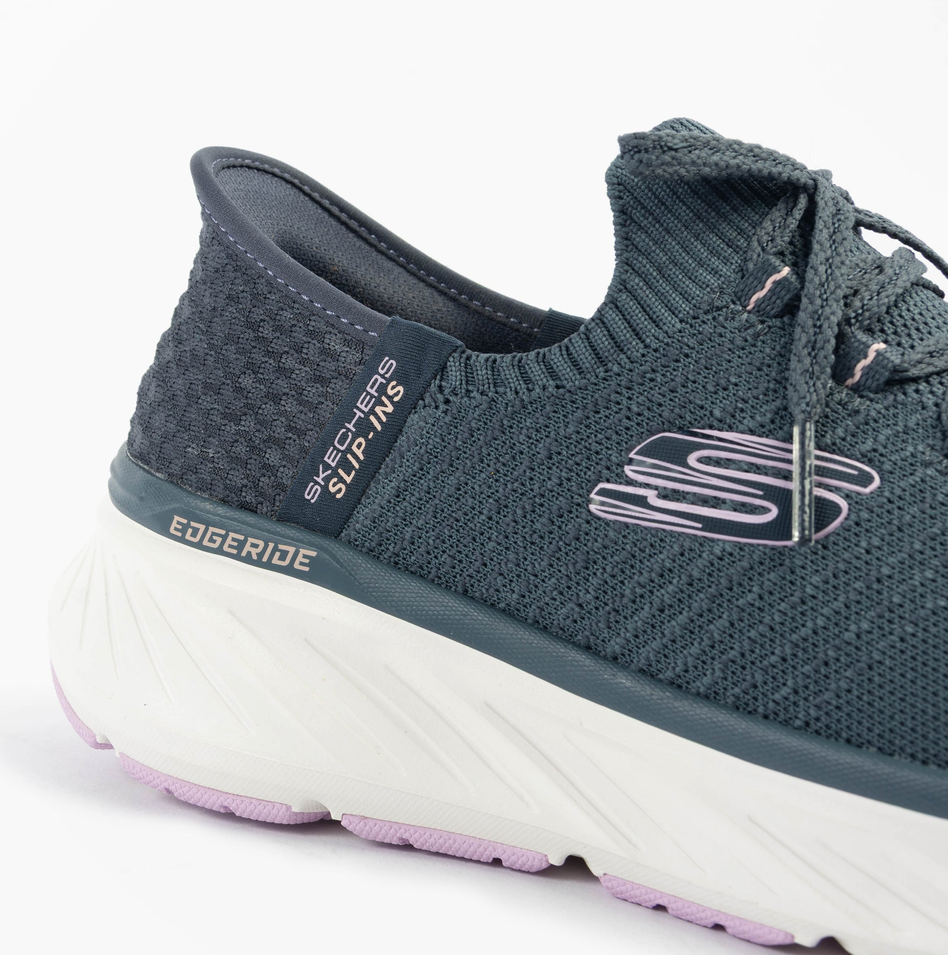 Skechers 150470/NVLV EDGERIDE - IMPRESSION Womens Trainers Blue side view highlighting the stylish upper and cushioned sole.