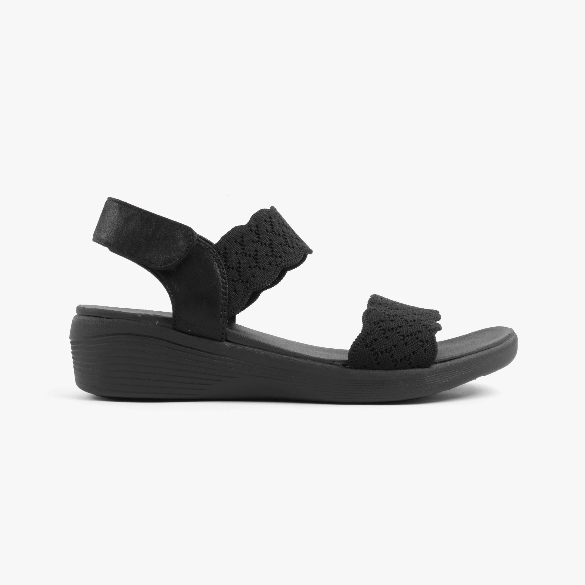 Skechers 163165/BBK ARYA - ON THE RISE Womens Sandals Black side view showing wedge heel and textile upper.