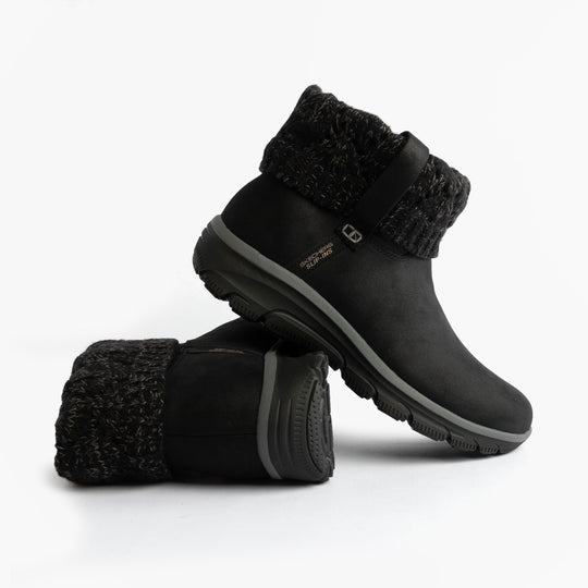 Skechers 168033/BLK EASY GOING - COZY WEATHER 2 Womens Boots Black side view, showcasing vegan leather and textured cuff.