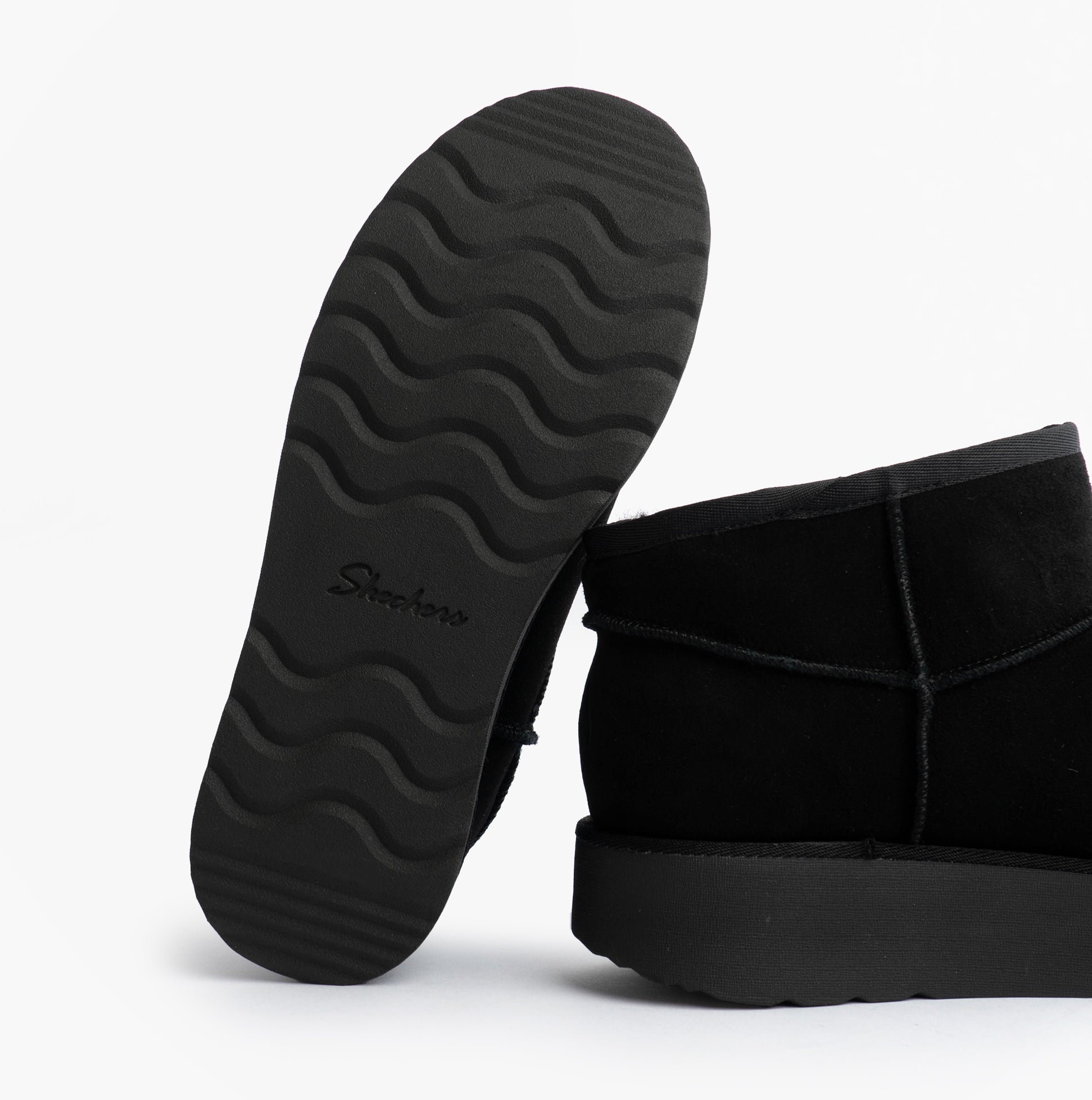 Skechers 169143/BBK KEEP COZY Womens Boots Black, bottom view showcasing rubber sole design and traction pattern.