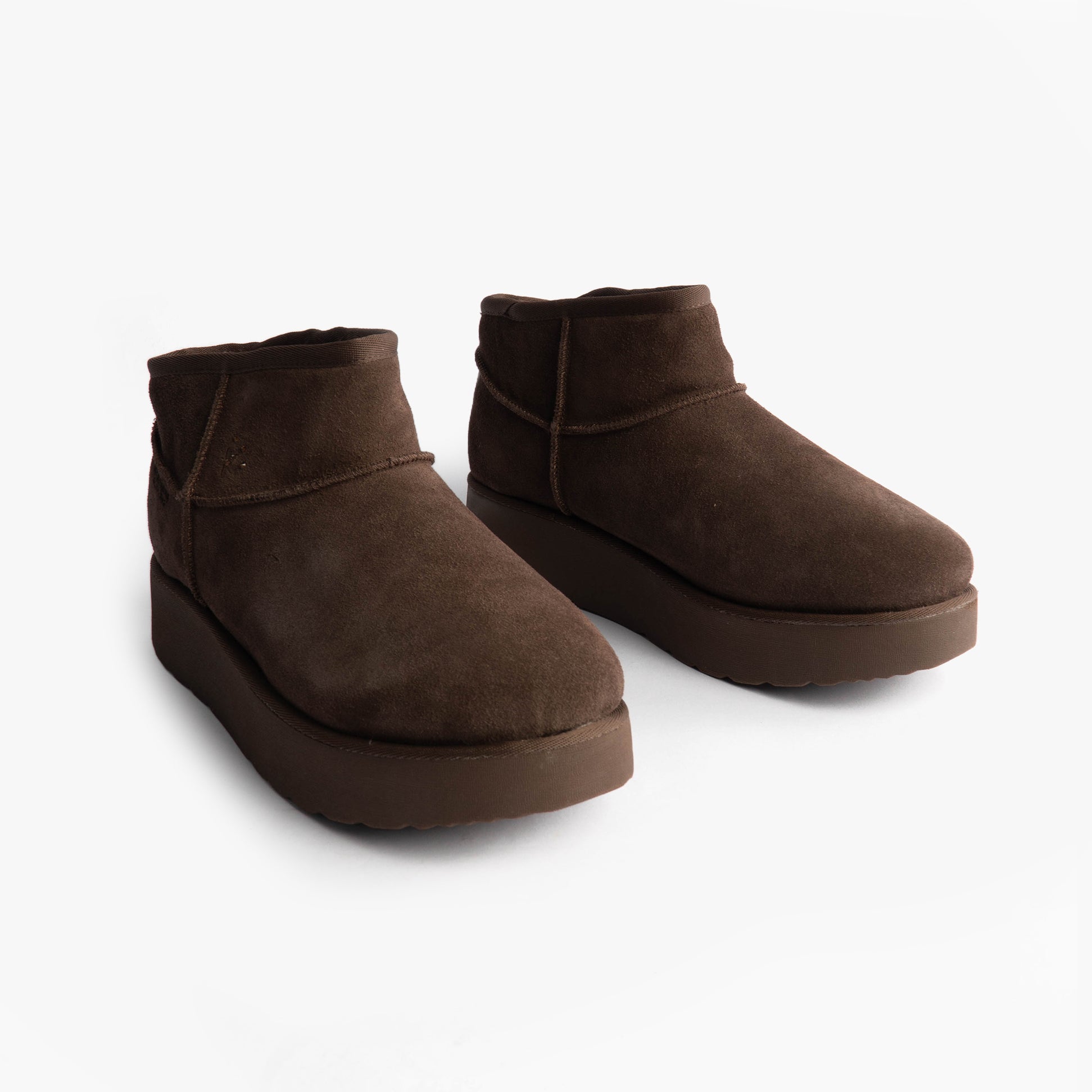 Skechers 169143/CHOC KEEP COZY Womens Boots Chocolate side view showcasing faux leather and shearling design.
